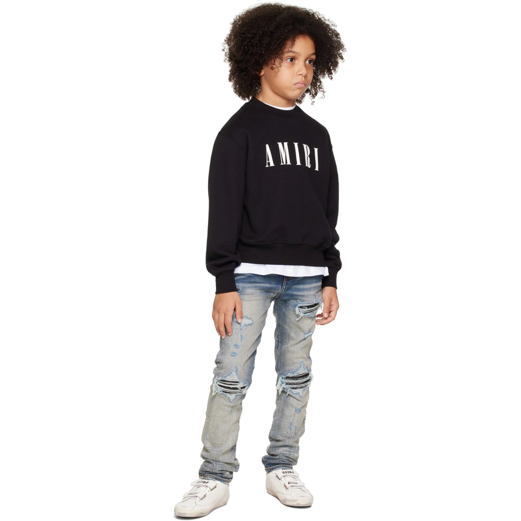 Model front view of Amiri Kids MX1 Clay Indigo Jeans PF22KDS034-408