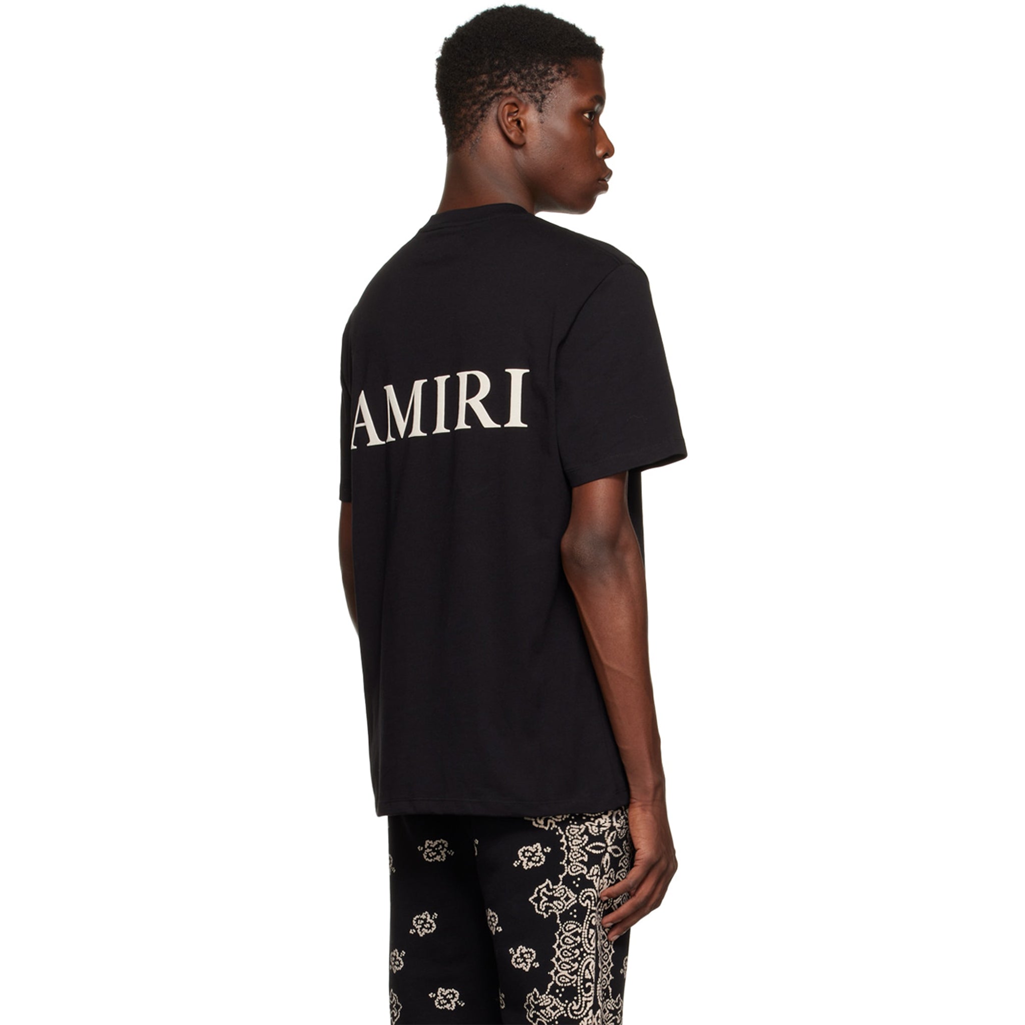 Model back view of Amiri Puff Logo T Shirt Black AW22MJL010-001