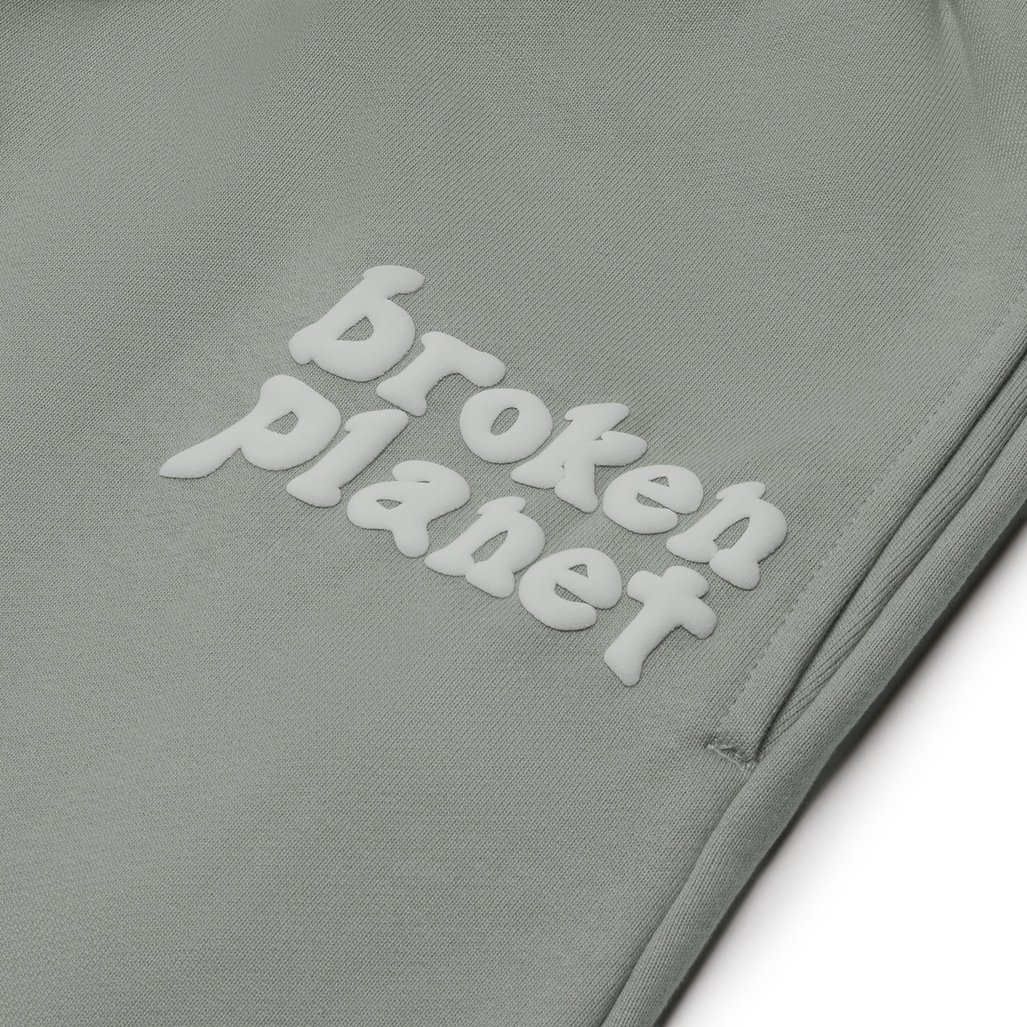Logo view of Broken Planet Basics Straight Leg Sweatpants Stone Grey BP-ZU-S_GRAY