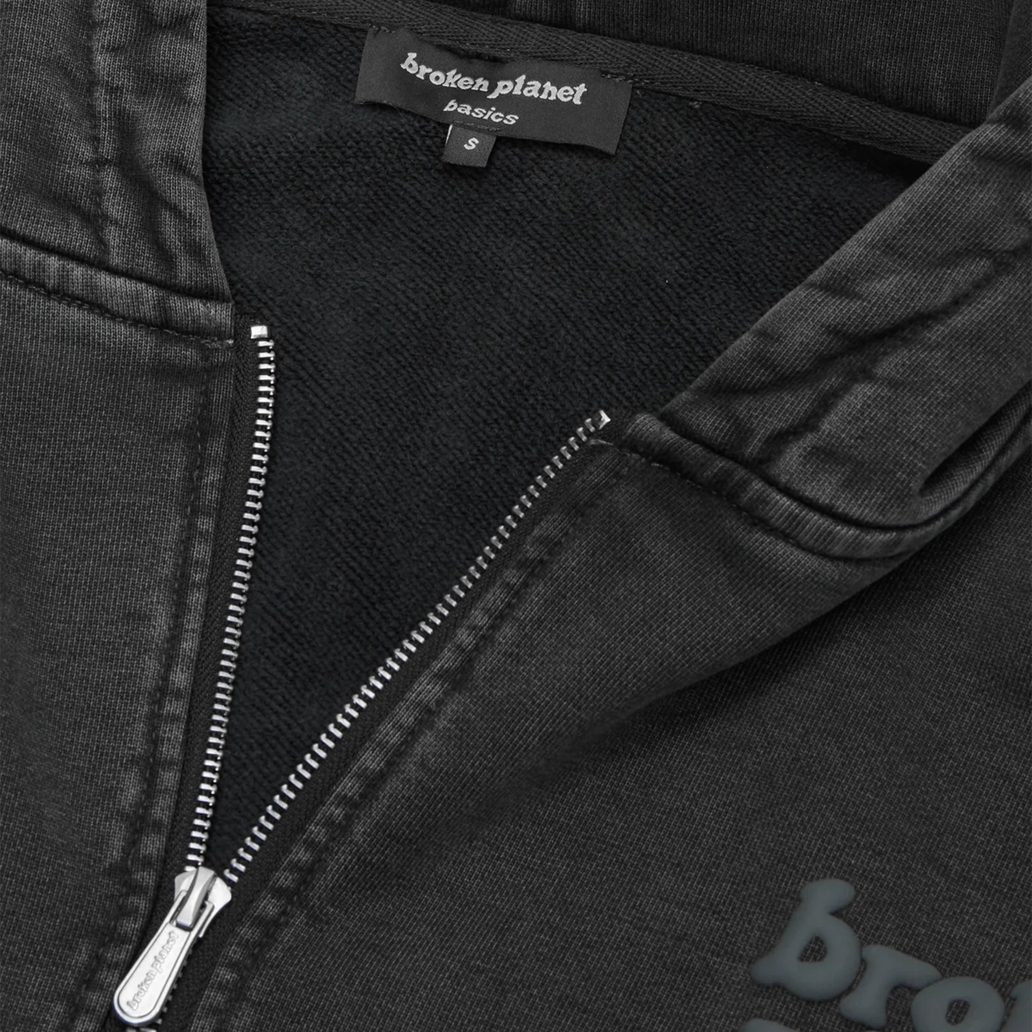 Neck view of Broken Planet Basics Washed Soot Black Cropped Zip-Up Hoodie