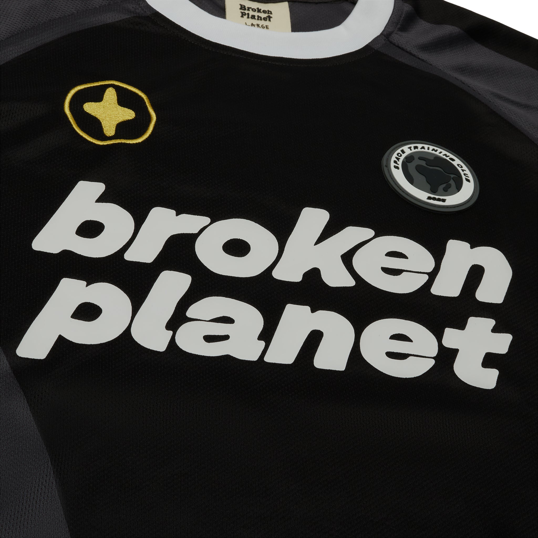 Chest view of Broken Planet Cosmic Speed Football T Shirt Black Grey BP-FT-BLACK/GRAY