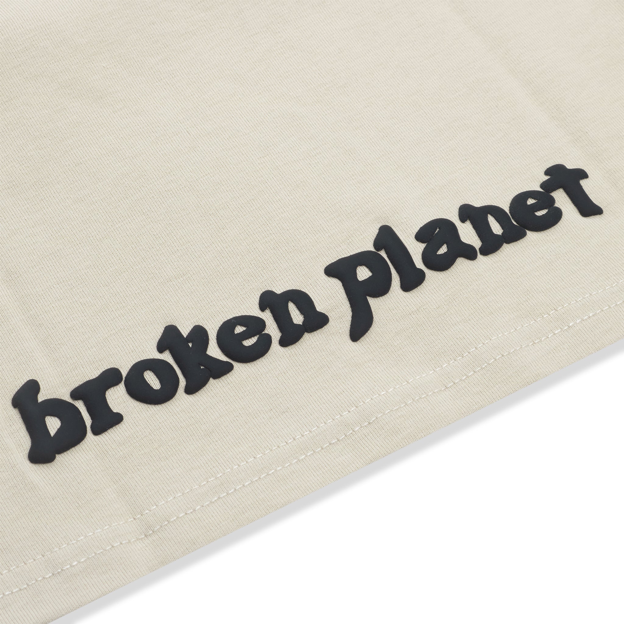 Bottom view of Broken Planet Find Your Balance Bone White Kids T Shirt BP-FYB-BT-B_WHITE