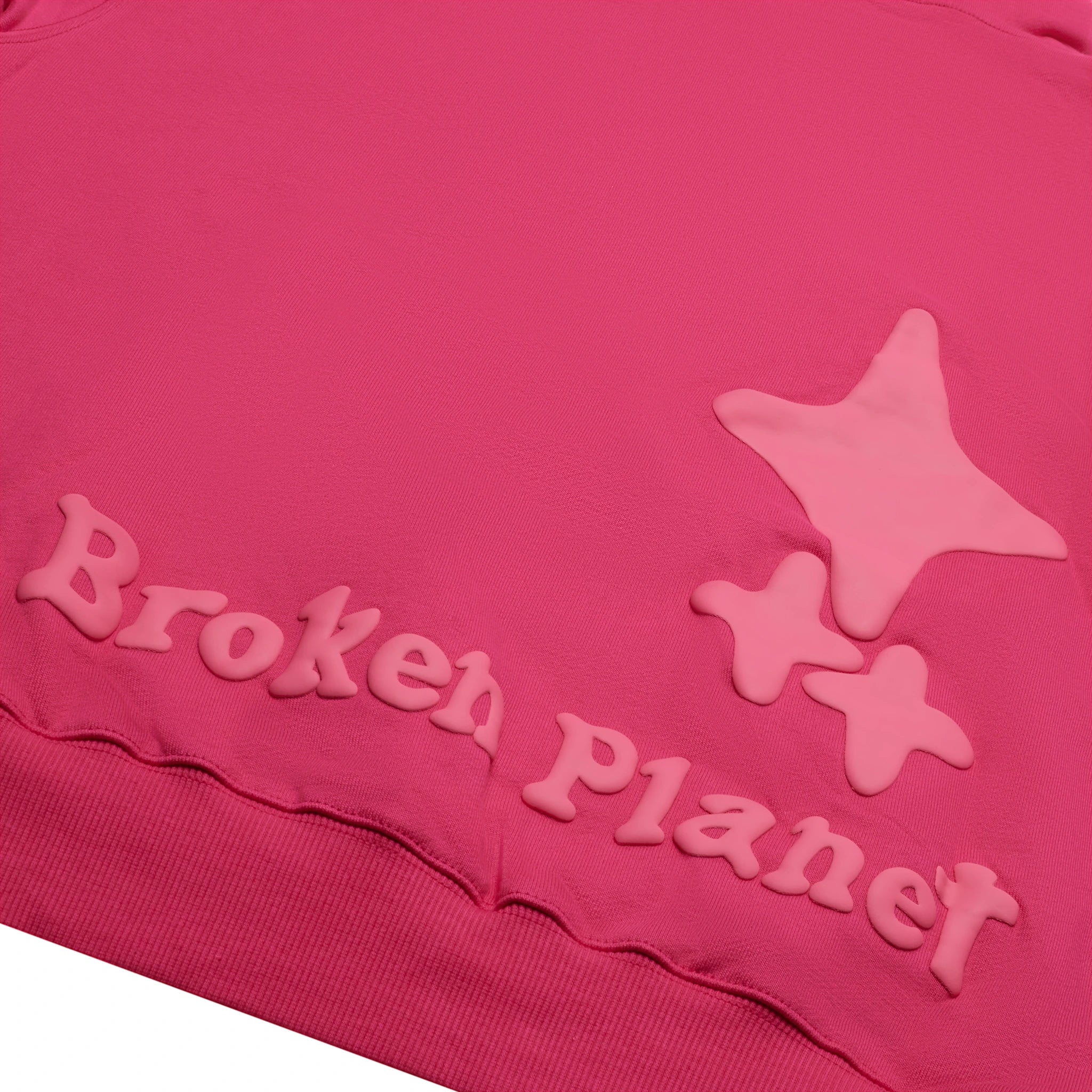 Back logo view of Broken Planet Monochrome Fuchsia Pink Hoodie
