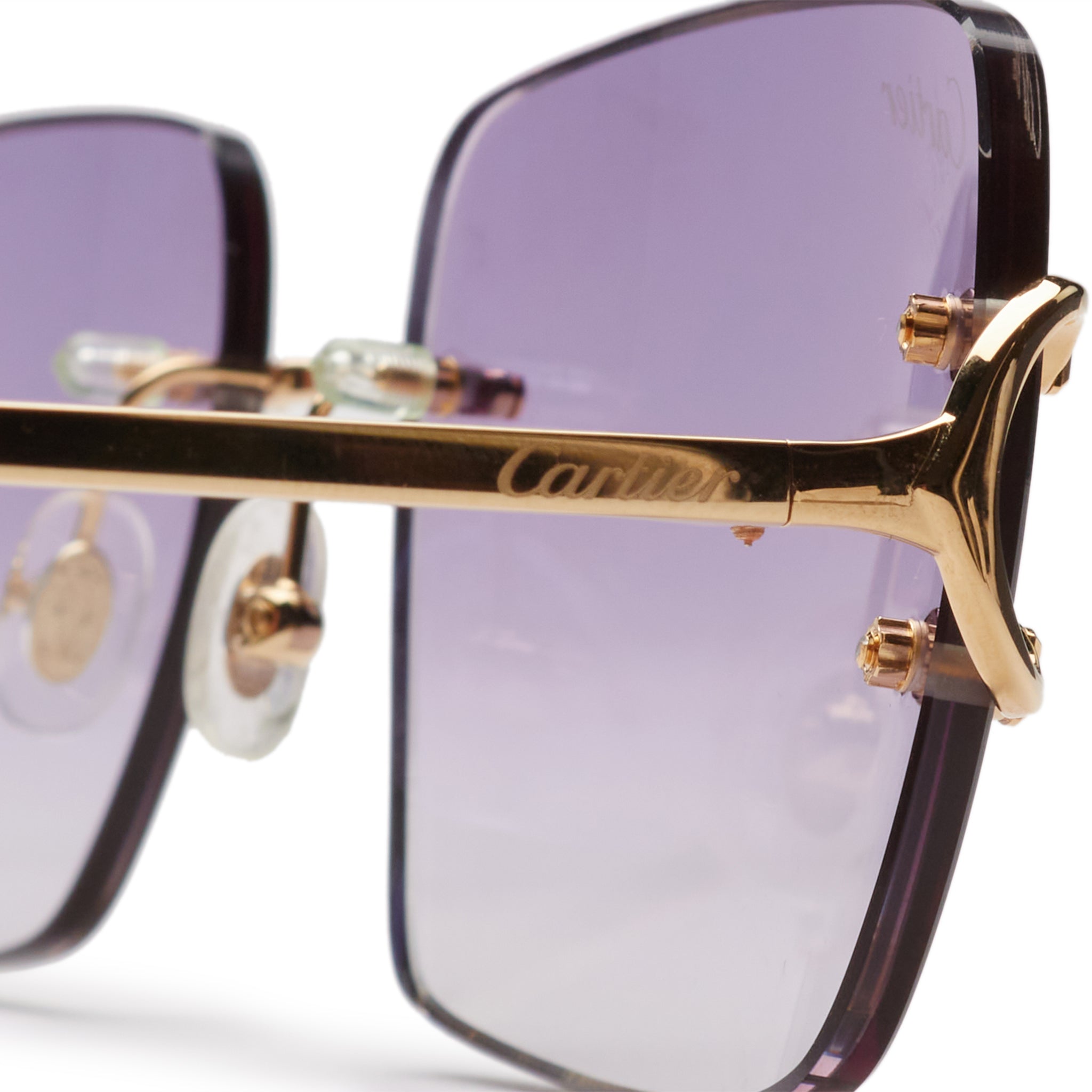 logo view of Cartier Eyewear Custom CT00920-001 C Decor Blue Rimless Sunglasses