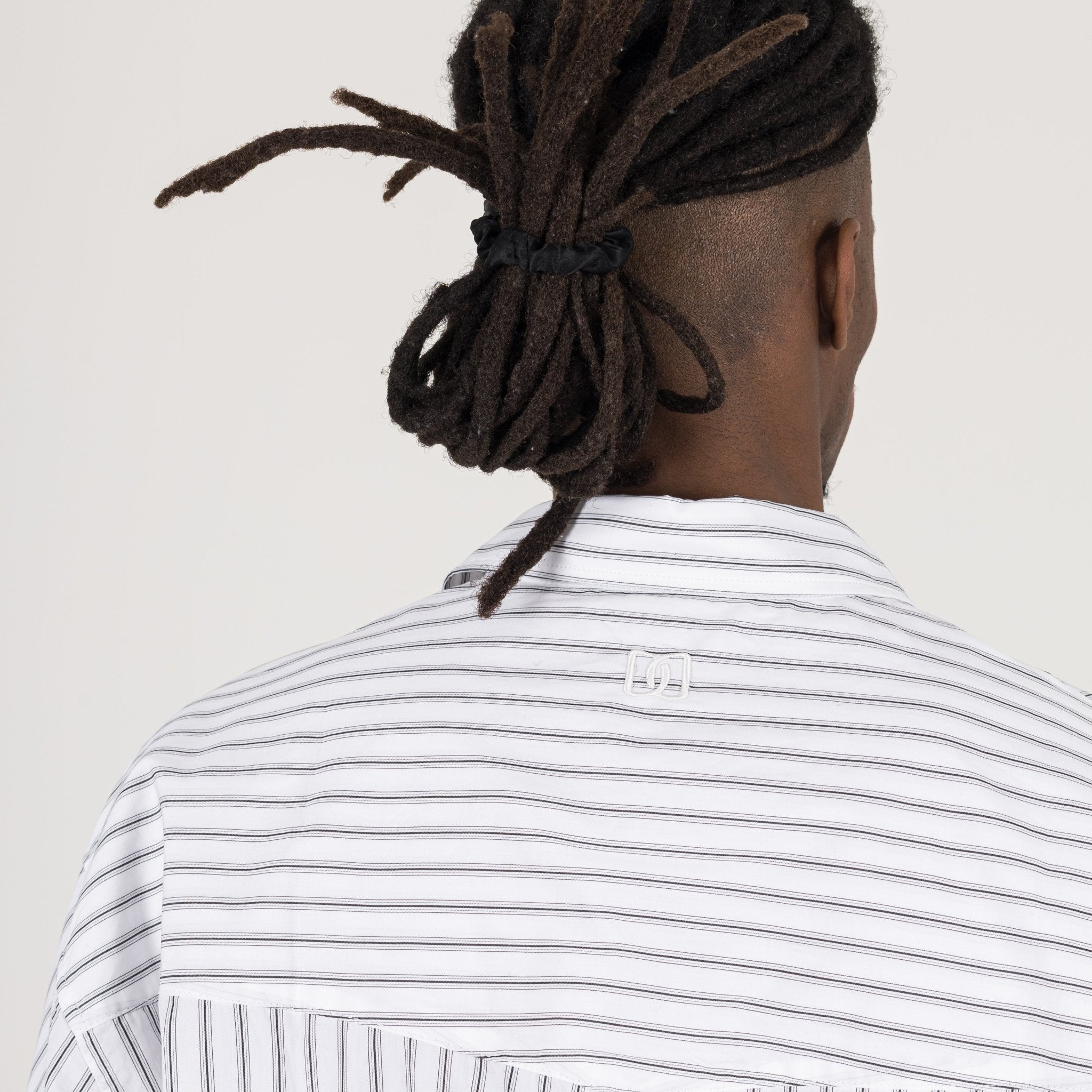 Detail view of Destructive Cropped L/S White Pinstripe Shirt