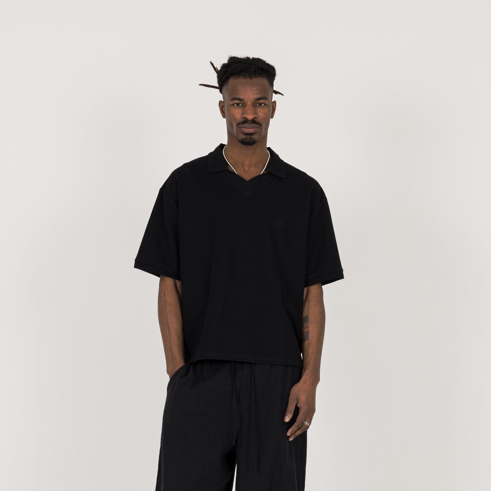 Model view of Destructive Cropped Black Polo Shirt