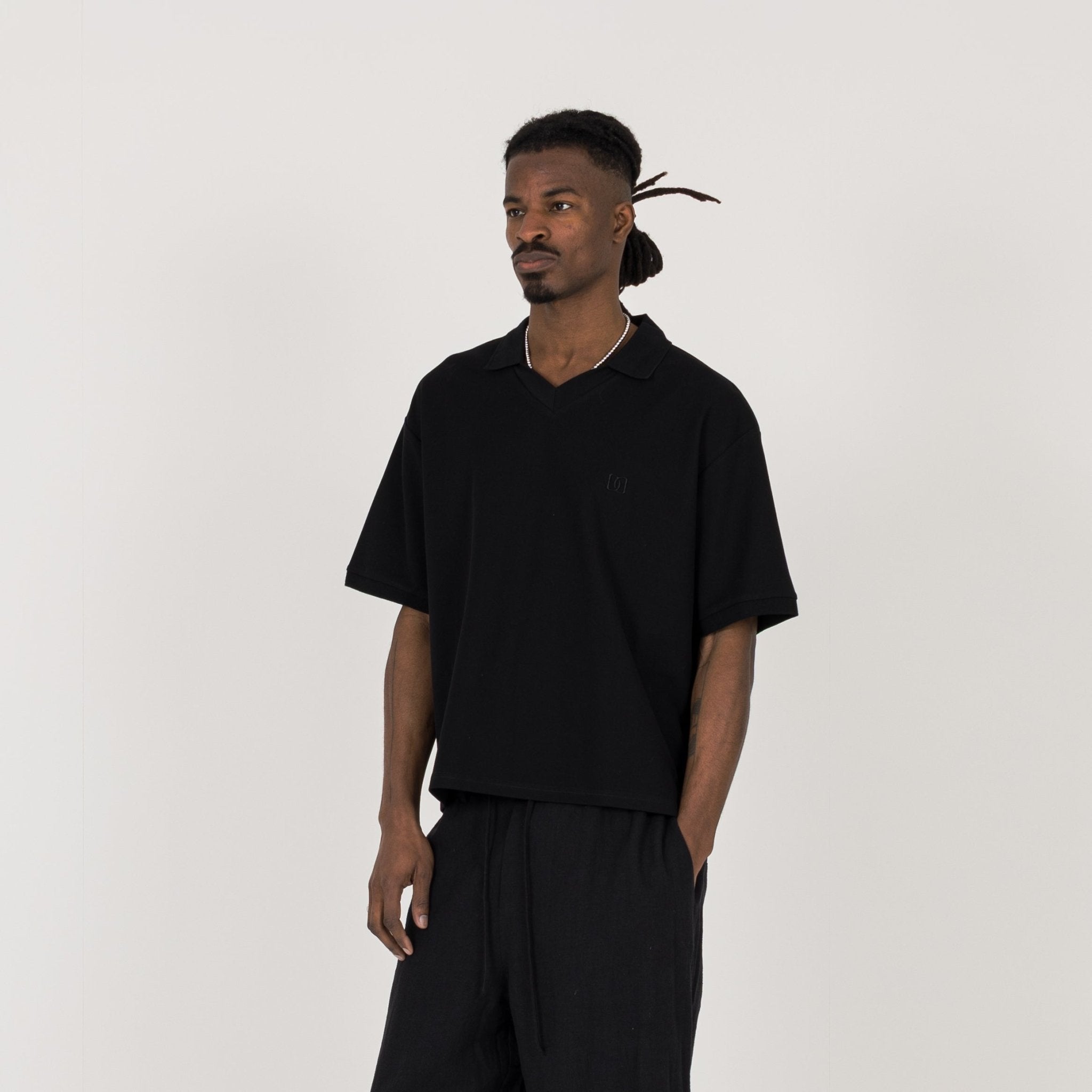 Model view of Destructive Cropped Black Polo Shirt