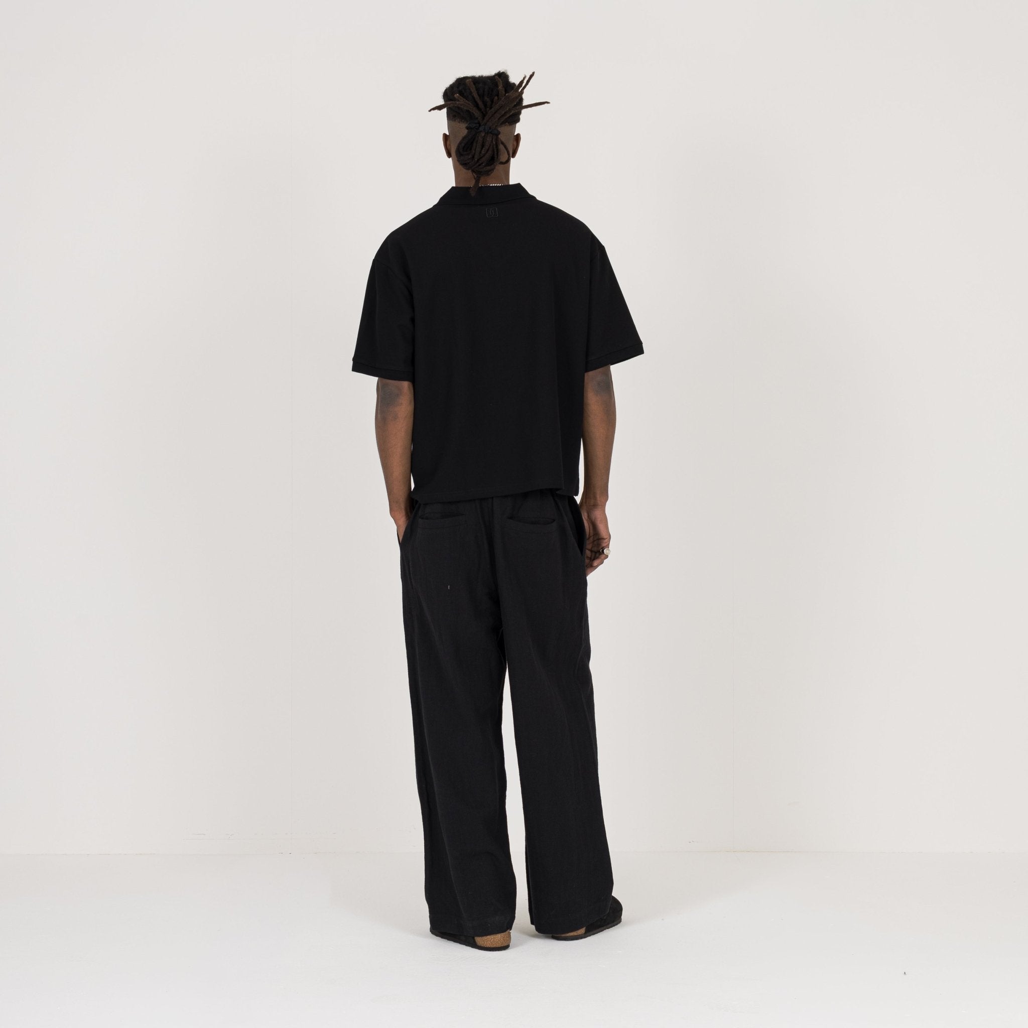 Model Back view of Destructive Cropped Black Polo Shirt