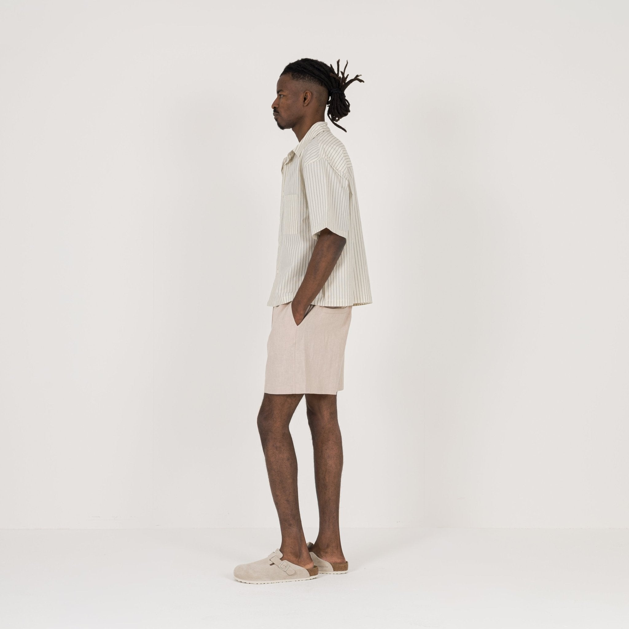 Model Side view of Destructive Cropped Bone Pinstripe Shirt