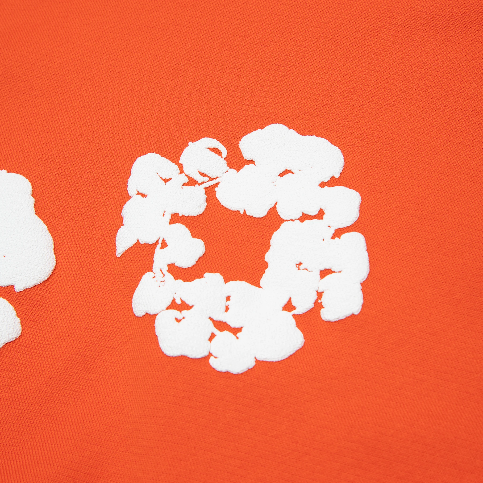 Detail view of Denim Tears The Cotton Wreath Orange Hoodie 
