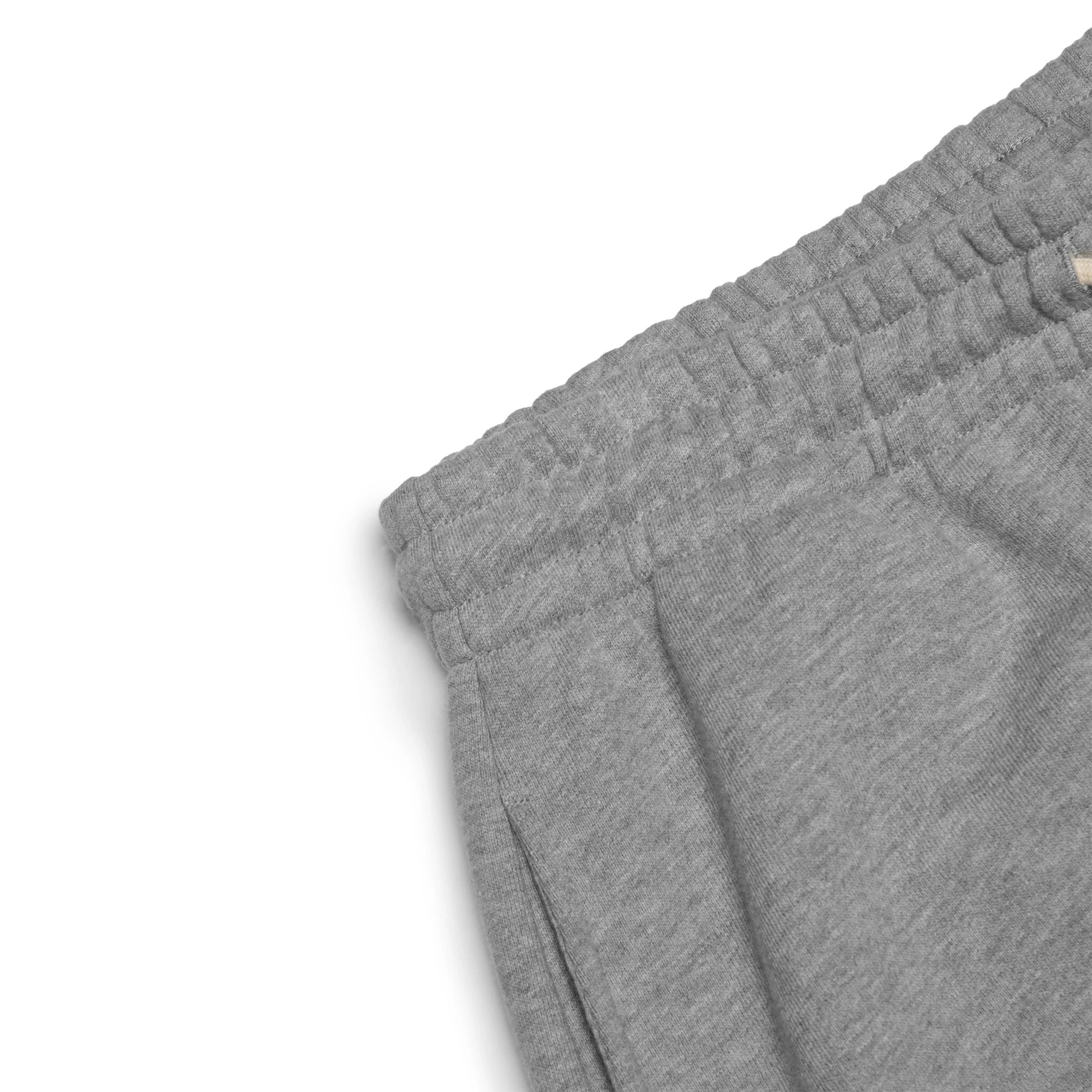 Corner view of Denim Tears University Grey Sweatpants 