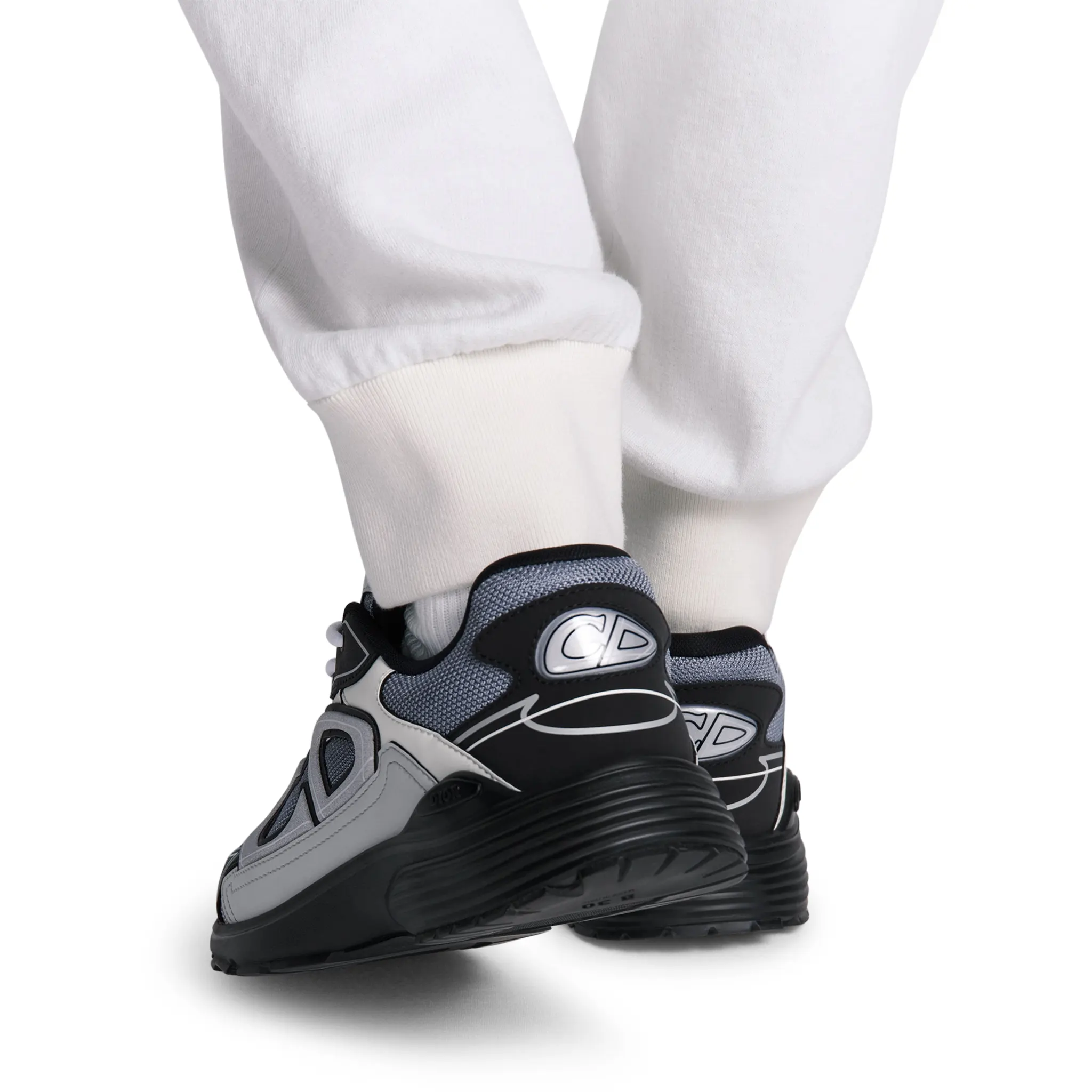 Model heel view of Dior B30 Mesh Blue Grey White Black Trainer 3SN279ZRB_H068