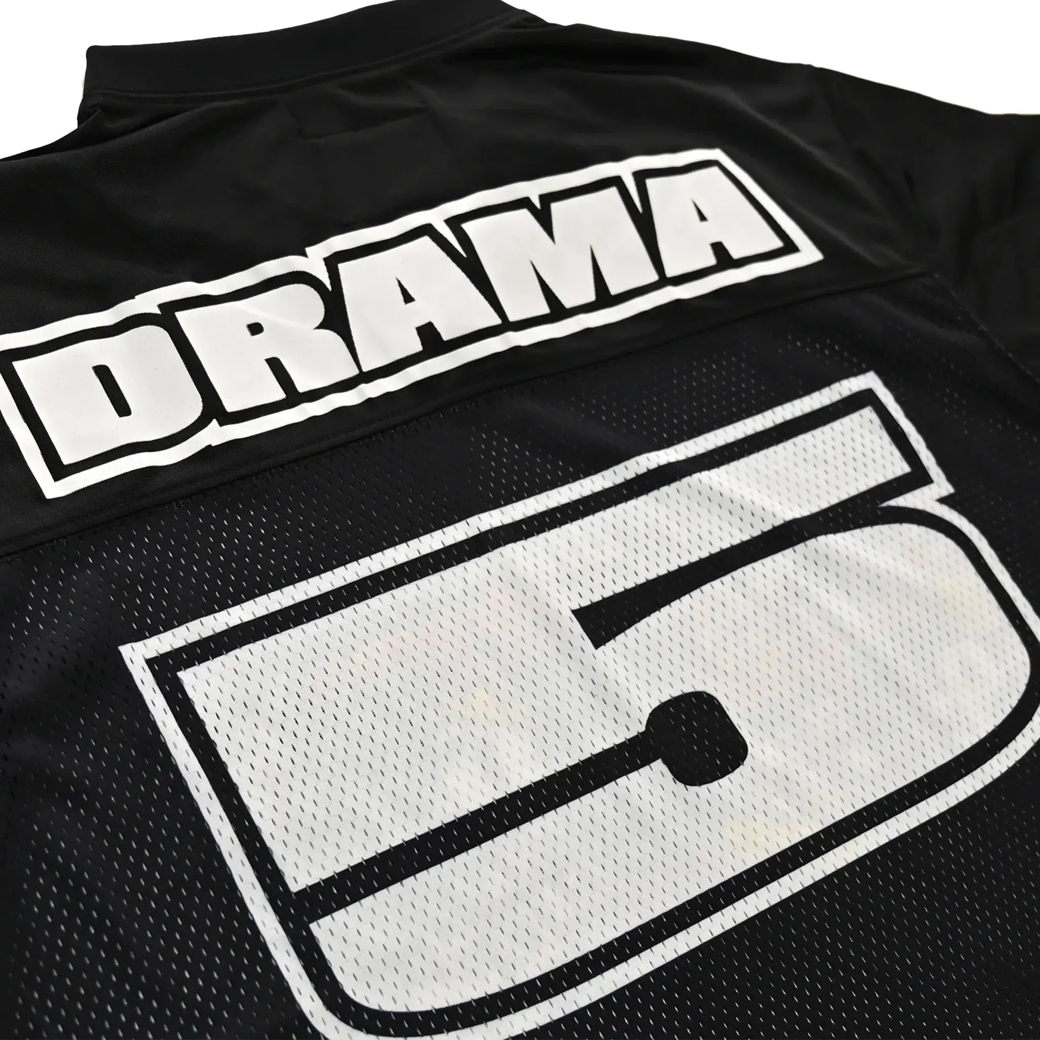 Logo view of Drama Call Black Football Jersey