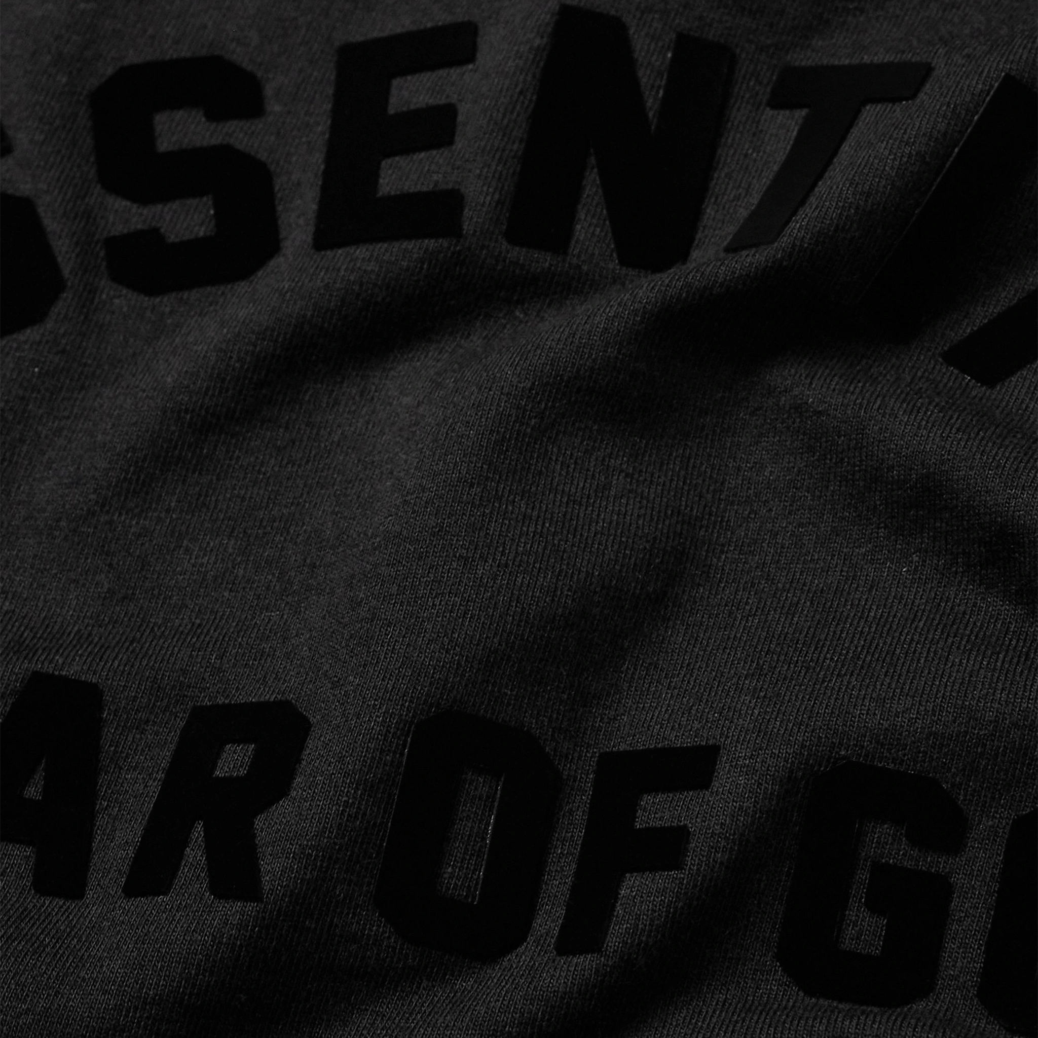 Logo view of Fear of God Essentials Arch Logo Jet Black T Shirt (SS23) 125SP232000F