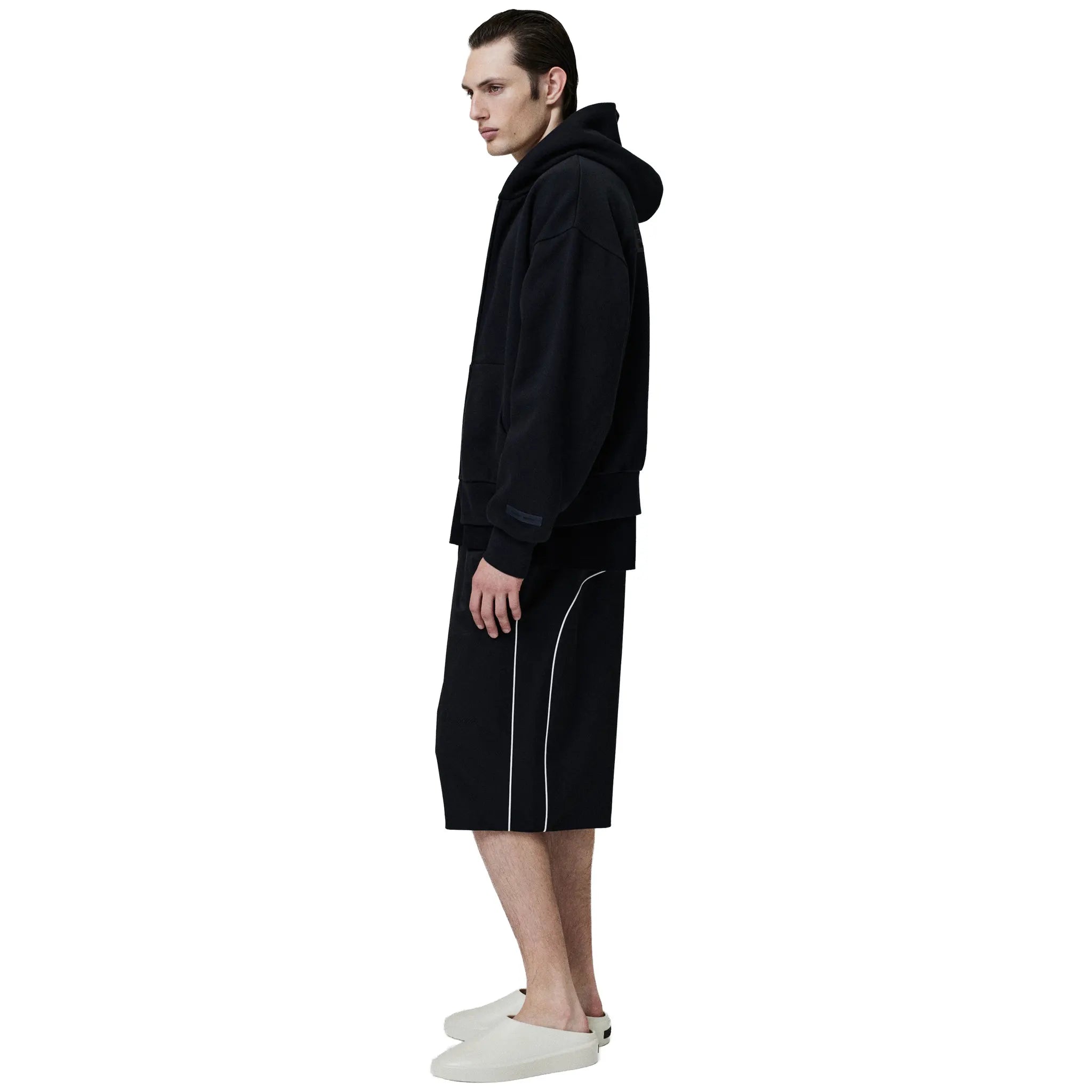 Side View of Fear Of God Essentials Classic Fleece Jet Black Metalic Zip-Up Hoodie (SS25) 192SP254780F