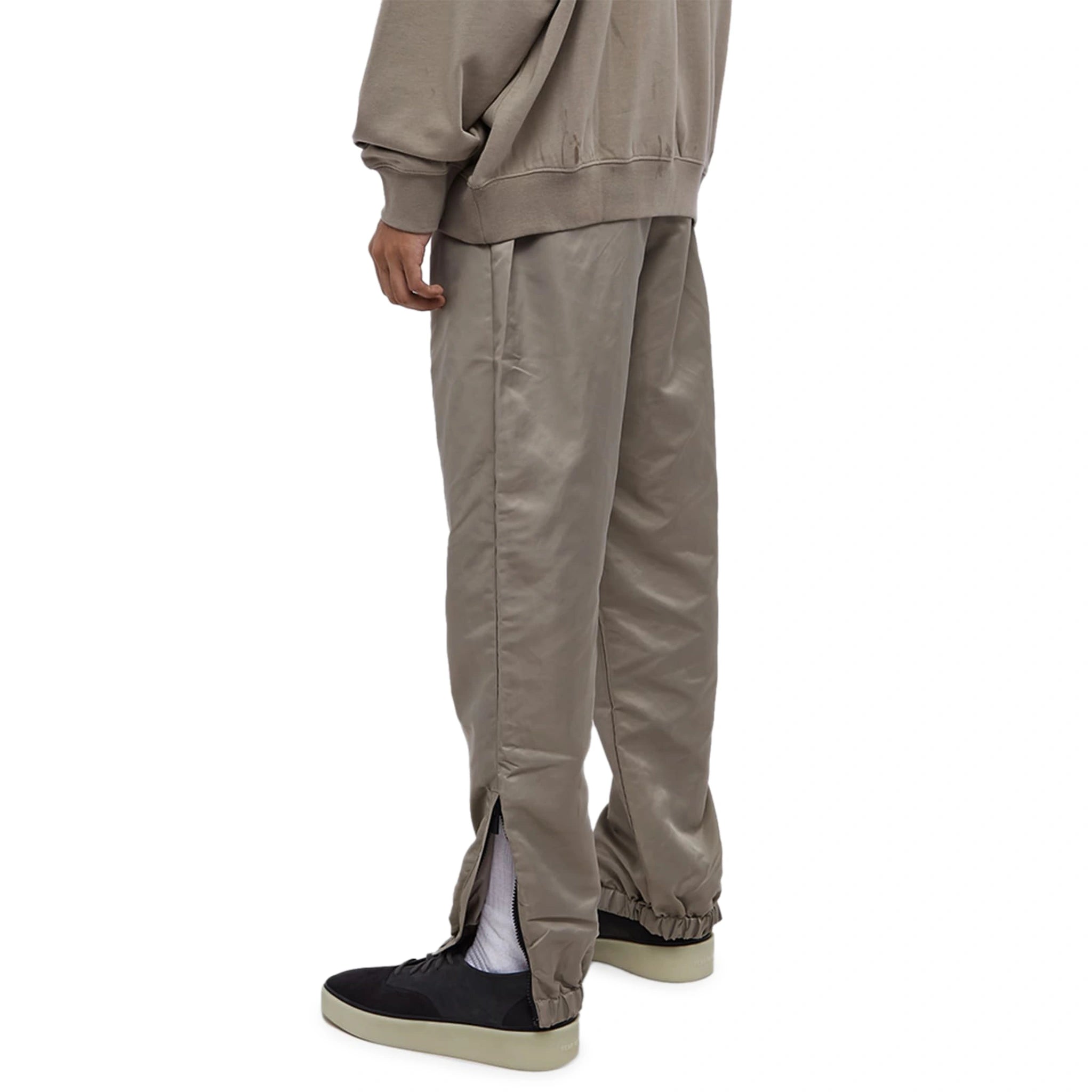 Model back view of Fear Of God Essentials Desert Taupe Track Pants (FW23) 130BT212161F