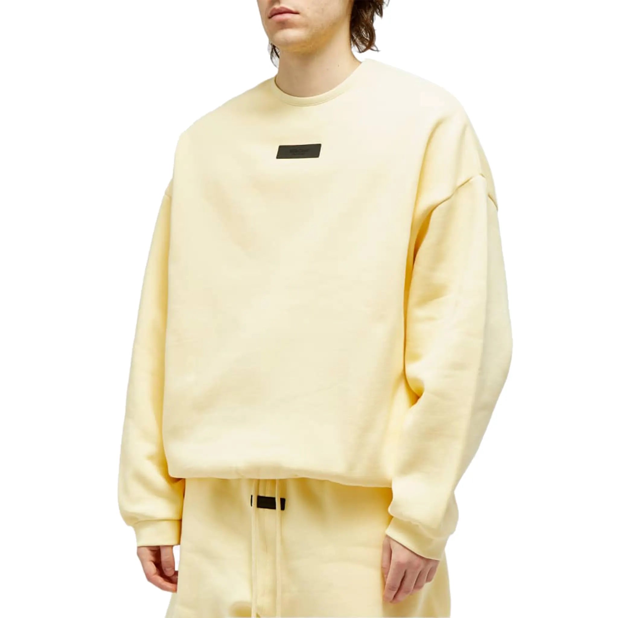 Model front view of Fear Of God Essentials Garden Yellow Crewneck (FW23) 192SP244681F