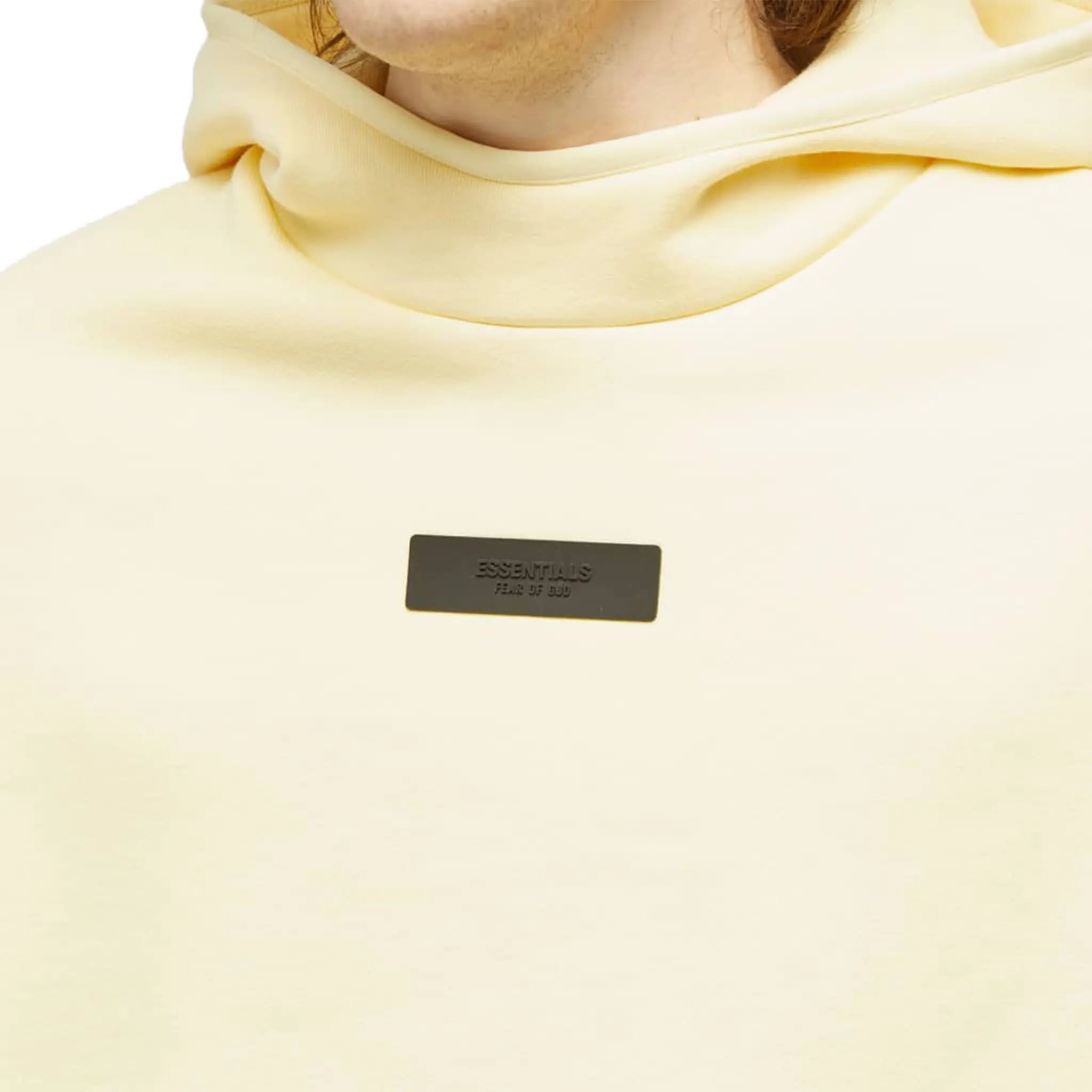 Model detail view of Fear Of God Essentials Garden Yellow Hoodie (FW23) 192SP242051F