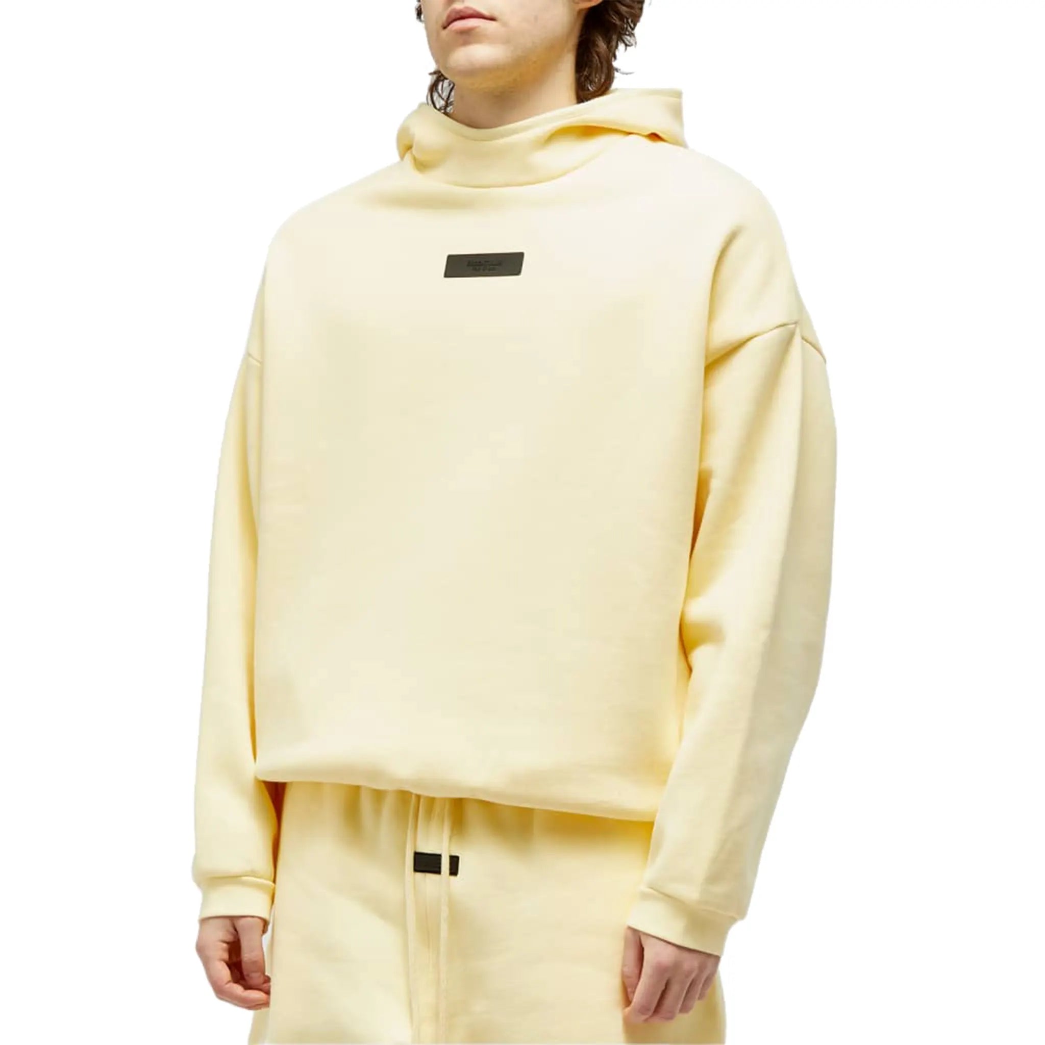 Model front view of Fear Of God Essentials Garden Yellow Hoodie (FW23) 192SP242051F