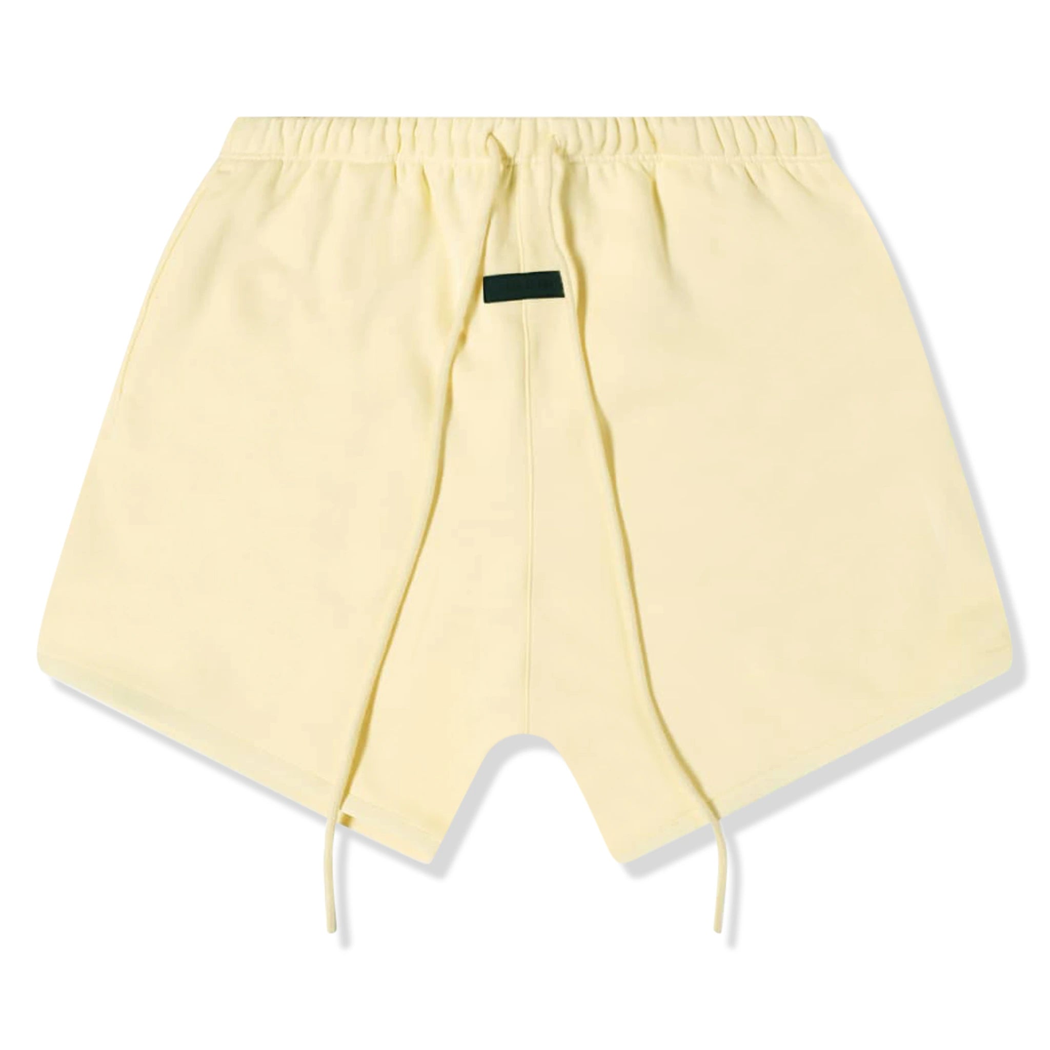 Front view of Fear Of God Essentials Garden Yellow Shorts (FW23) 125SP244191F