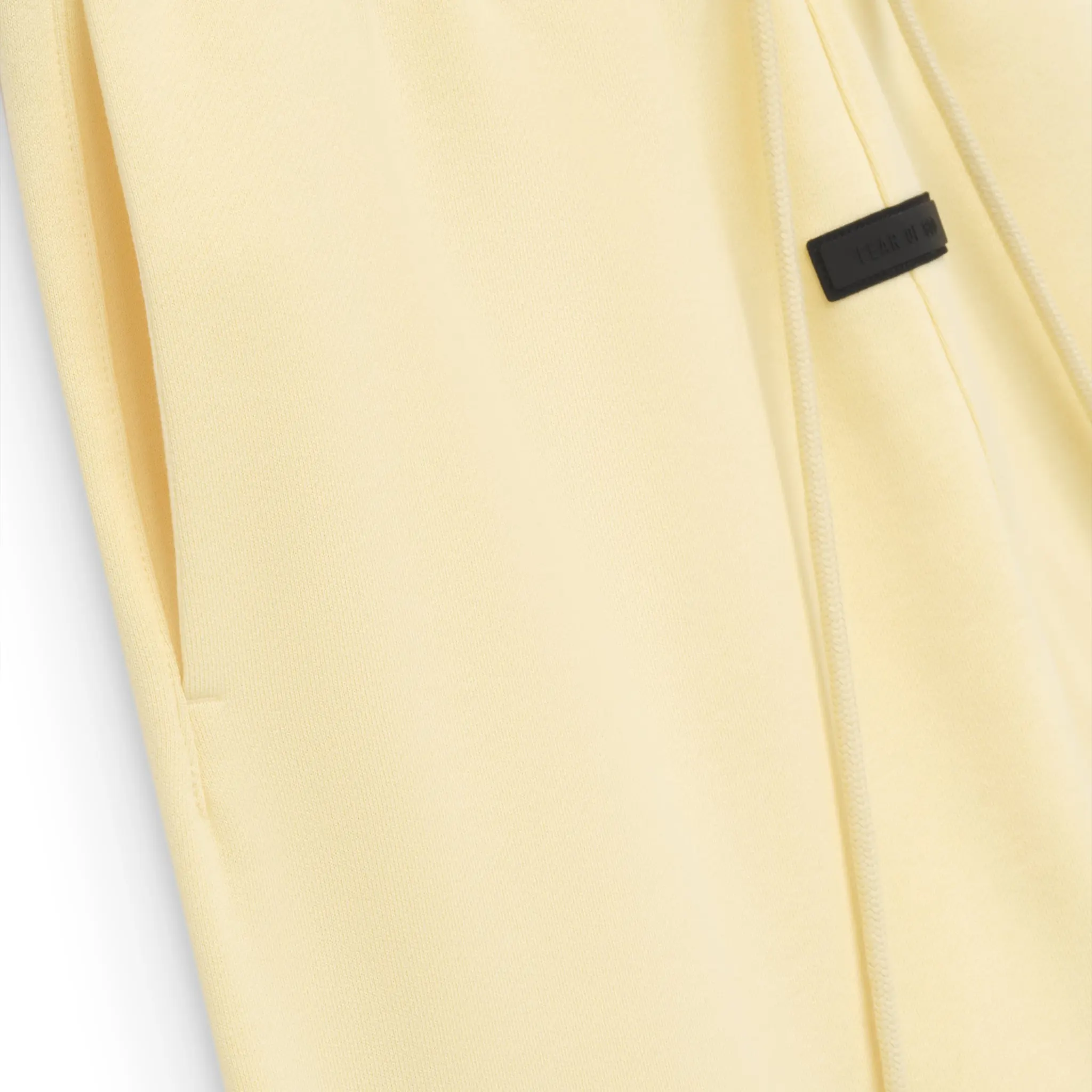 Pocket view of Fear Of God Essentials Garden Yellow Sweatpants (FW23) 130SP242021F