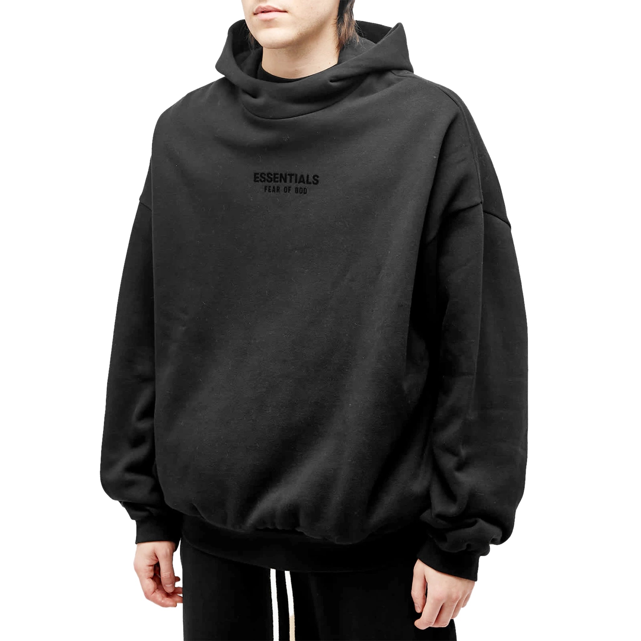 Model front view of Fear Of God Essentials Jet Black Hoodie (FW23)