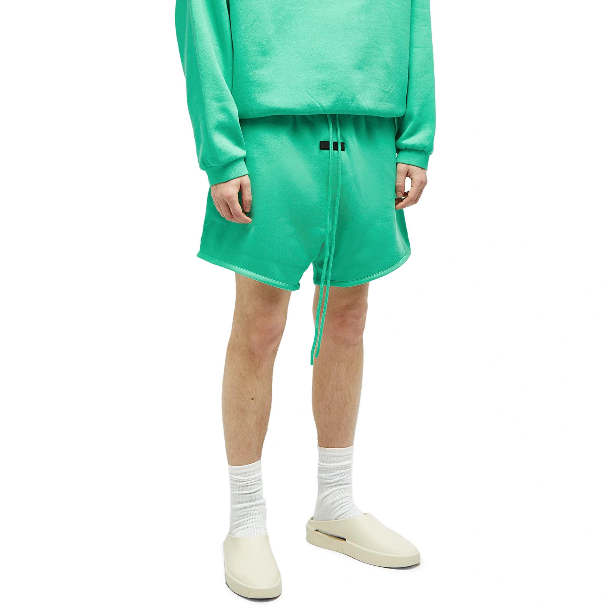Model front view of Fear Of God Essentials Mint Leaf Shorts (FW23) 160SP242002F