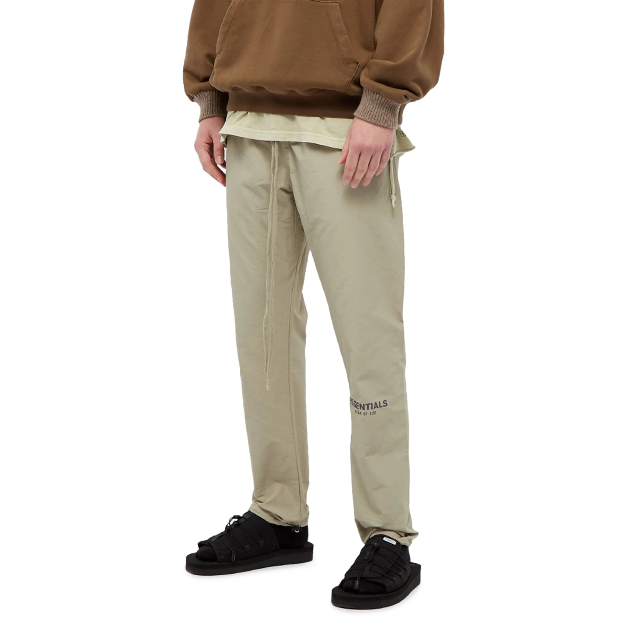 Model front view of Fear Of God Essentials Pistachio Track Pants
