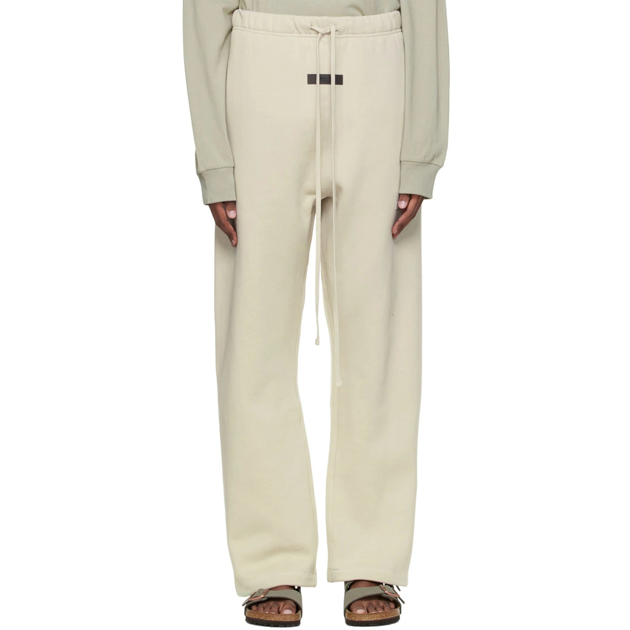 Model front view of Fear Of God Essentials Relaxed Wheat Sweatpants (SS22) 130BT212047F