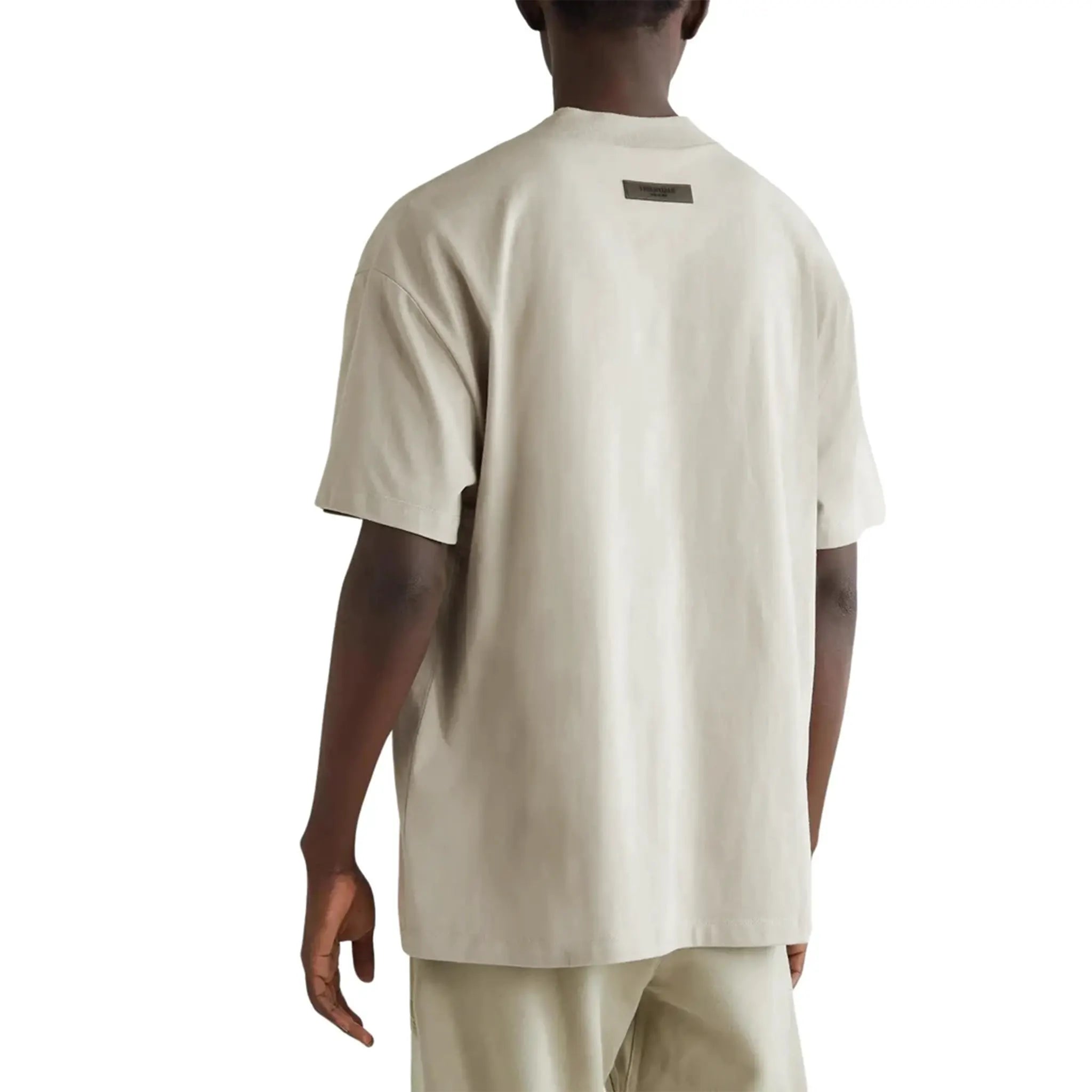 Model Back view of Fear Of God Essentials Short Sleeve Smoke T Shirt (FW22) 125SU222001F