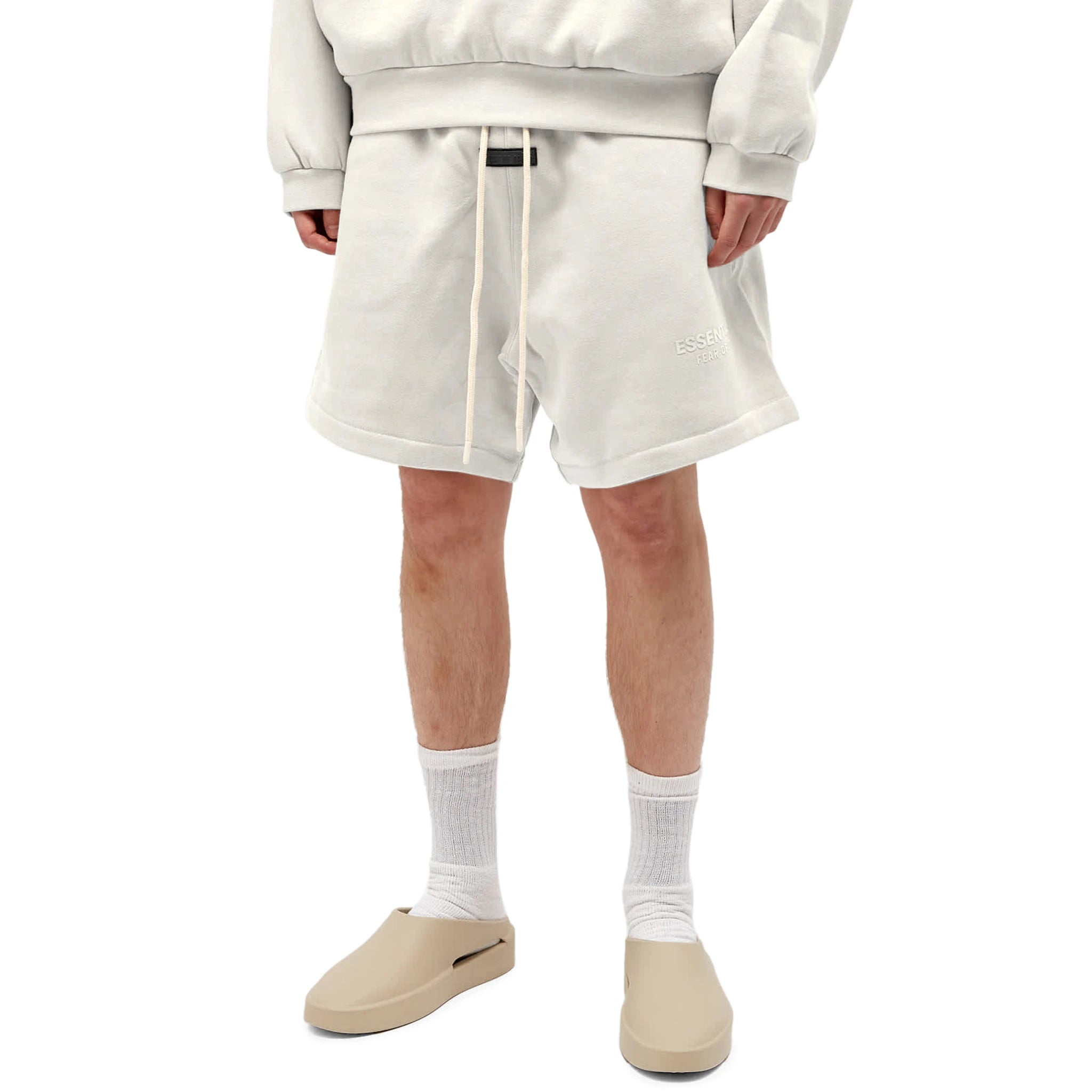 Model front view of Fear Of God Essentials Silver Cloud Shorts (FW23)