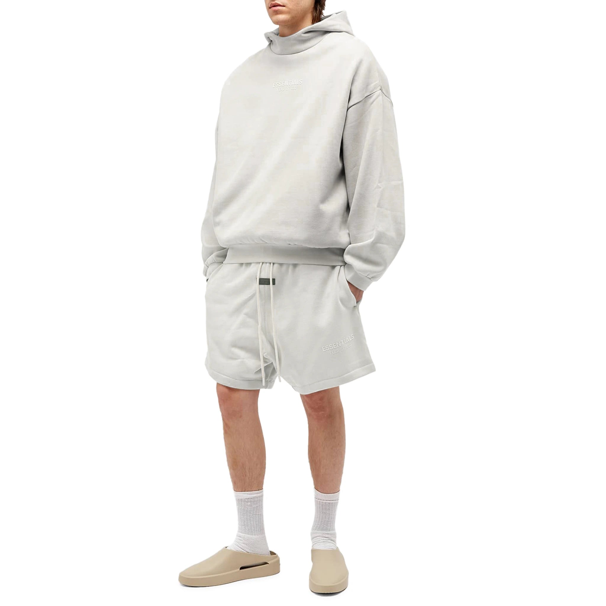Model front view of Fear Of God Essentials Silver Cloud Shorts (FW23)