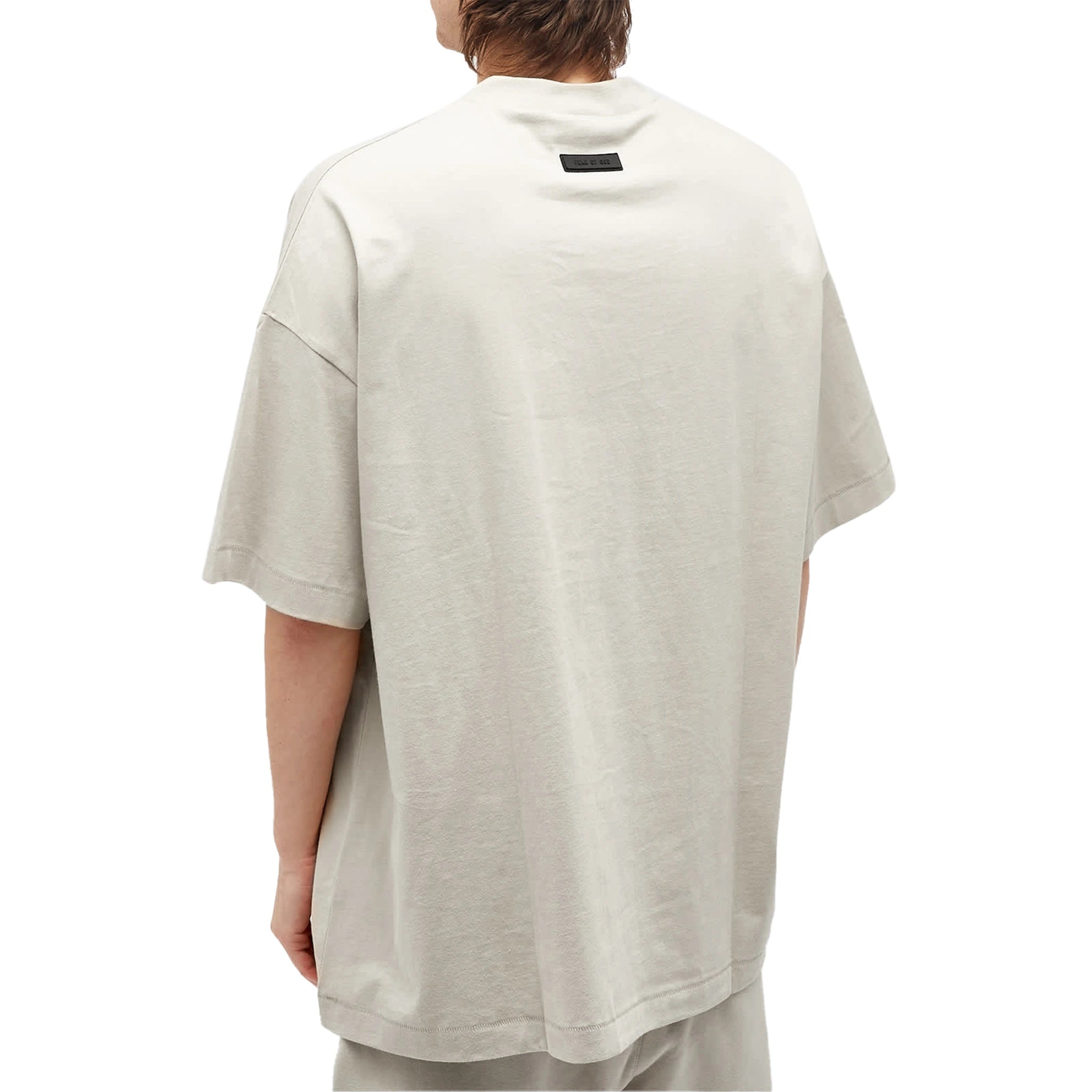Model back view of Fear Of God Essentials Silver Cloud T Shirt (FW23)