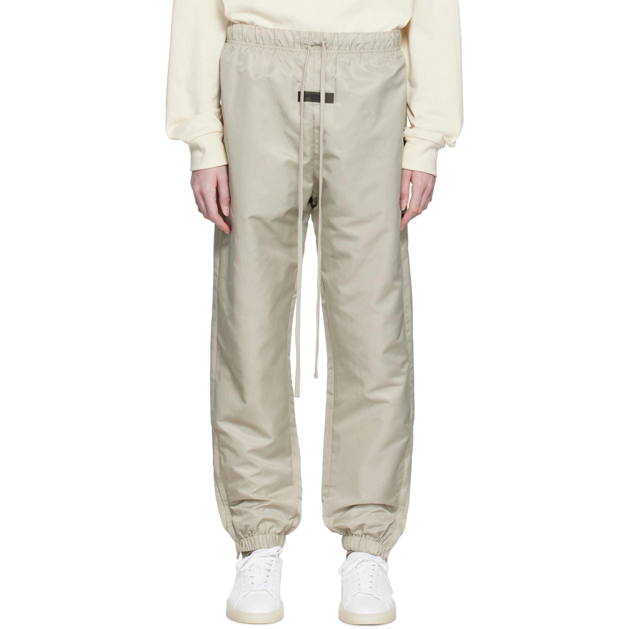 Model front view of Fear Of God Essentials Smoke Track Pants (FW22) 130SU222161F