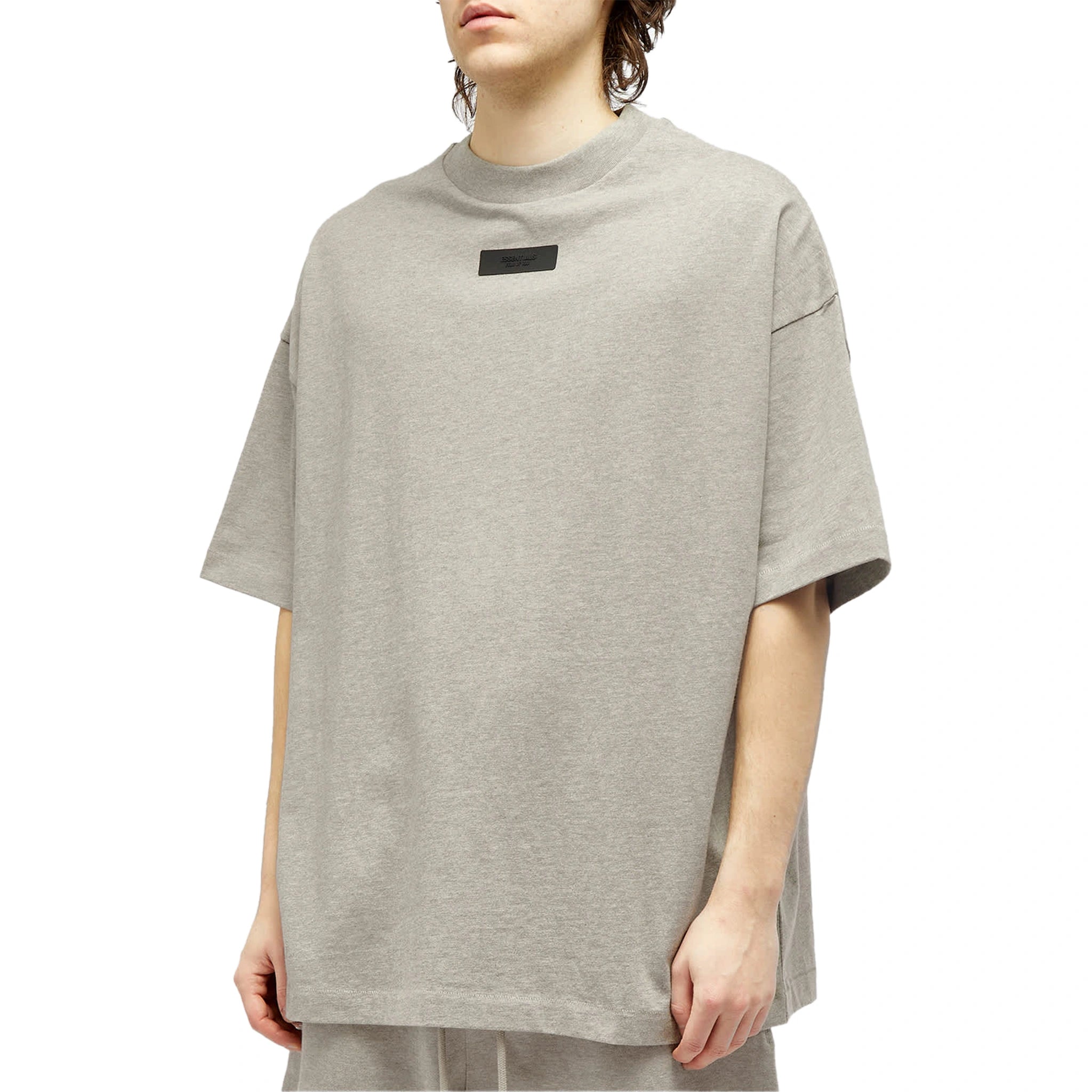 Model front side view of Fear of God Essentials SS Dark Heather Oatmeal T Shirt (FW23) 125SP244193F