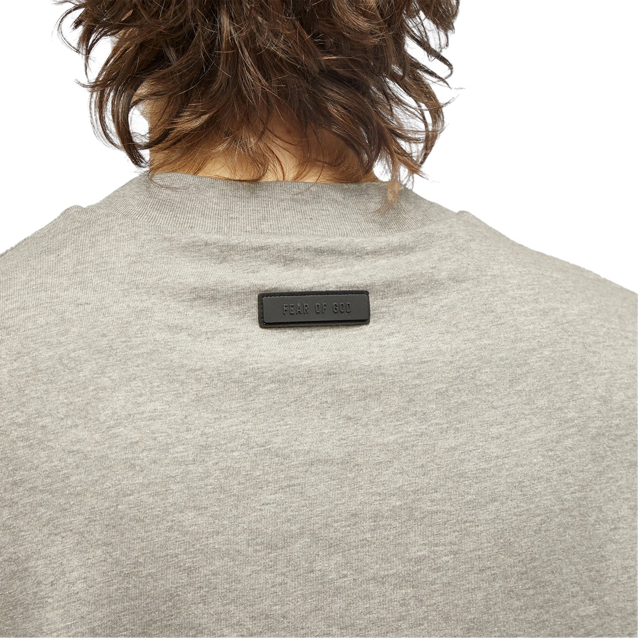Model neck view of Fear of God Essentials SS Dark Heather Oatmeal T Shirt (FW23) 125SP244193F