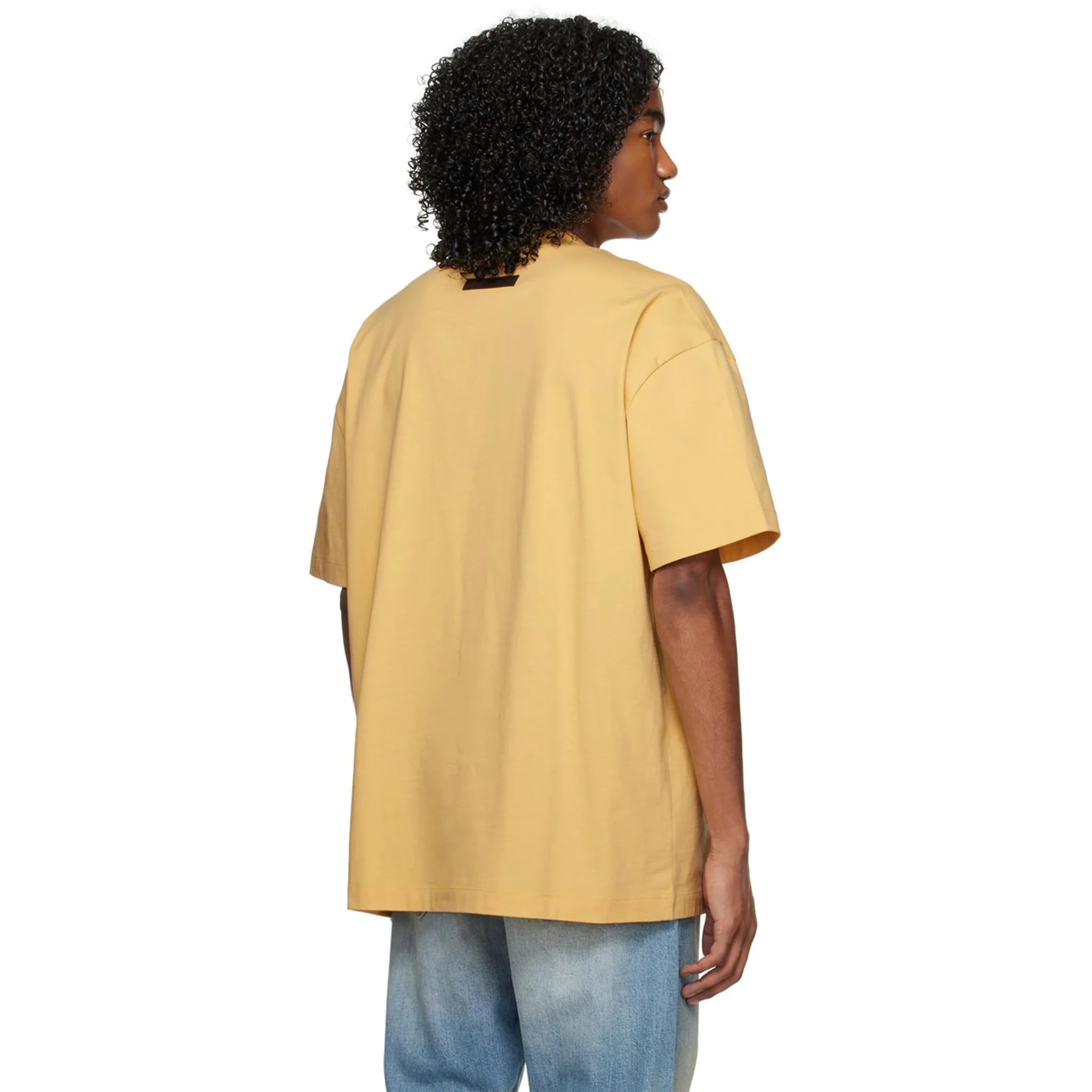 Model back view of Fear of God Essentials SS Light Tuscan T Shirt (SS23)