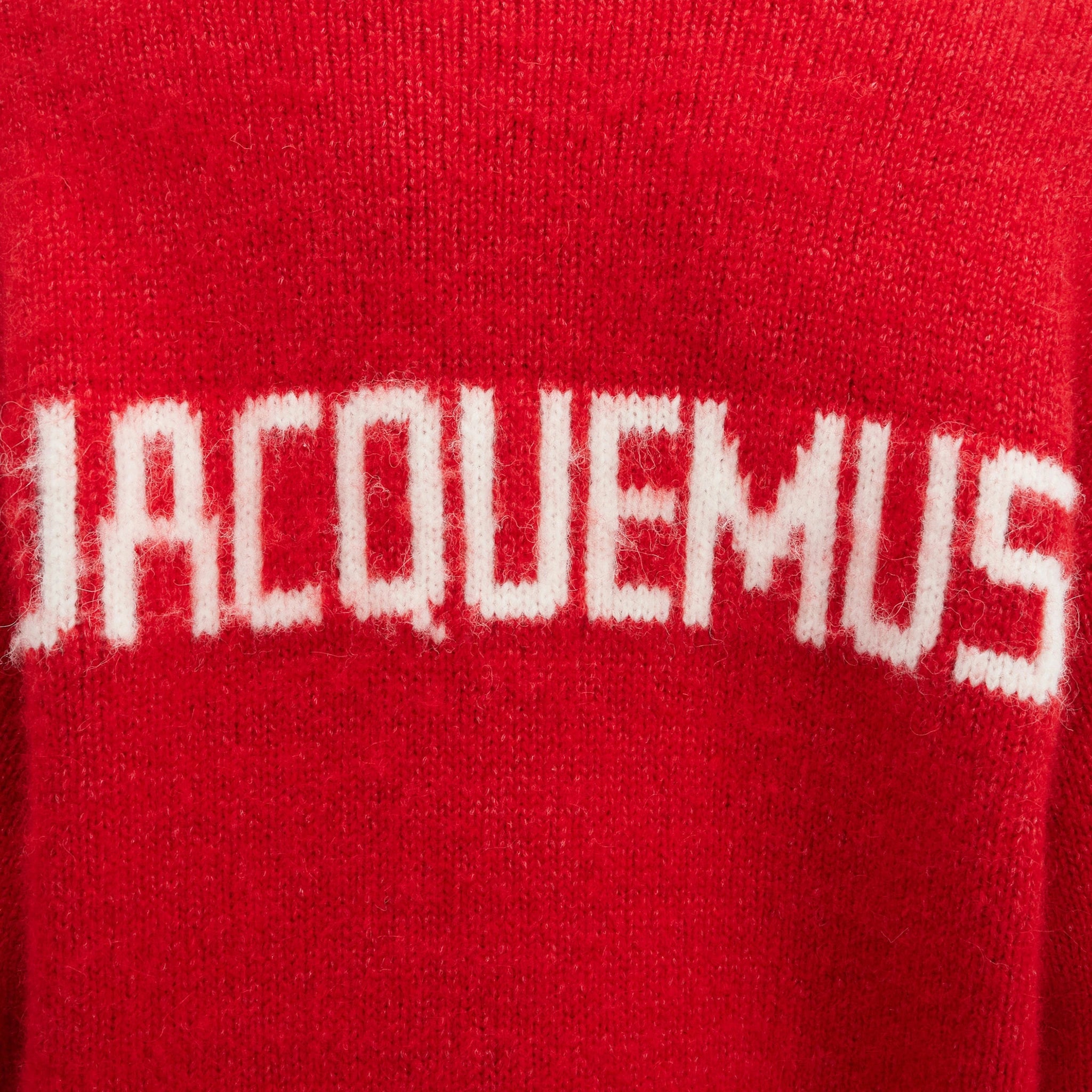 MOdel detail view of Jacquemus La Maille Pavane Red Knit 236KN284-2329-470