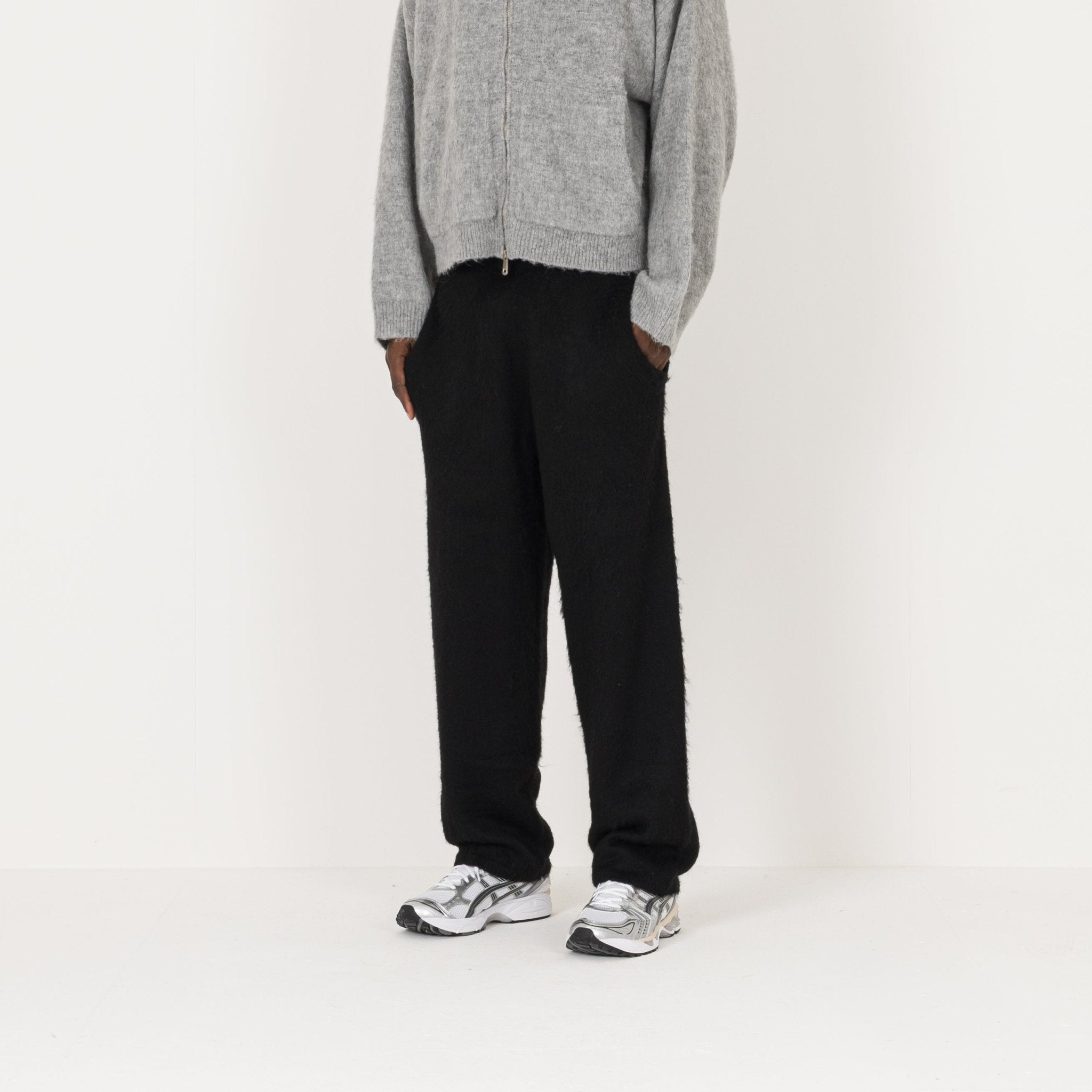 Side view of Destructive Mohair Black Sweatpants