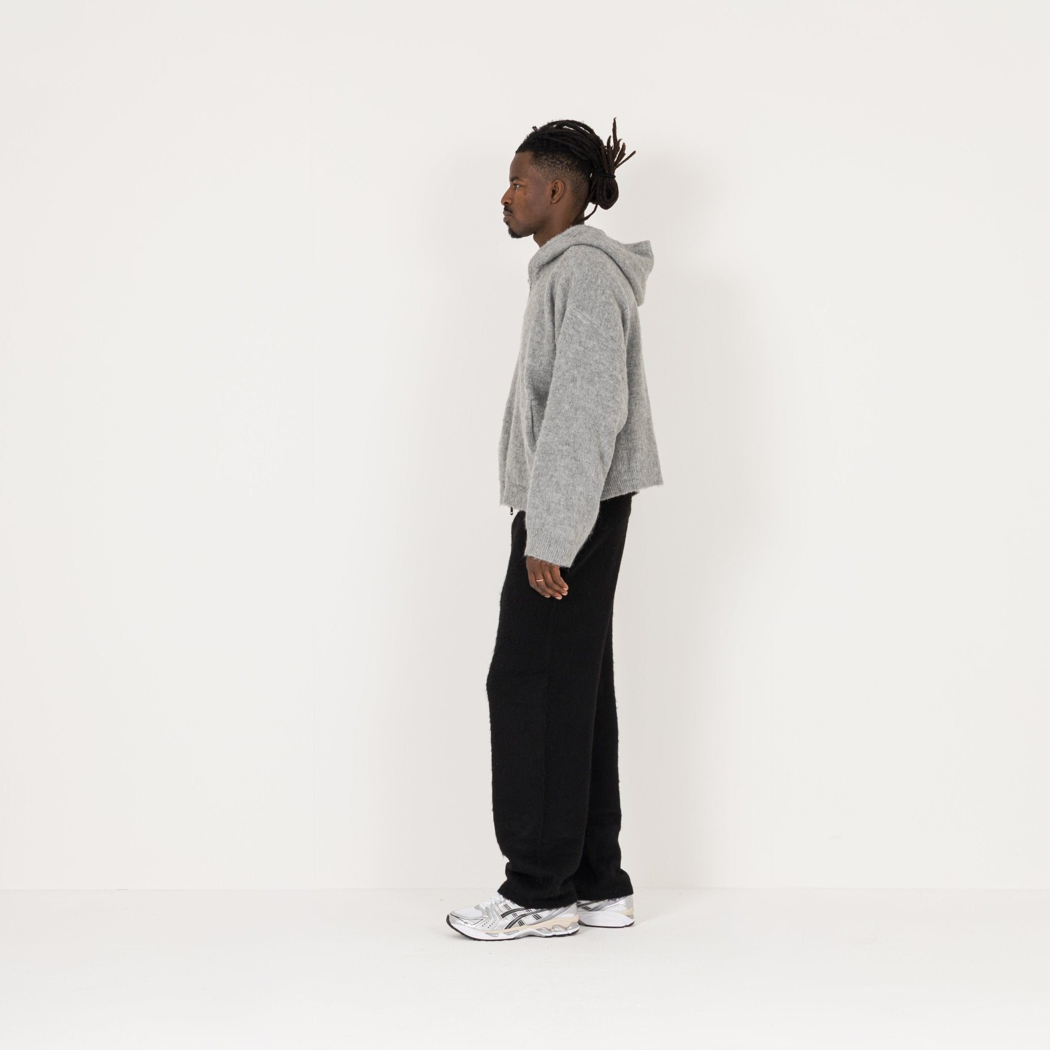 Model Side view of Destructive Mohair Black Sweatpants