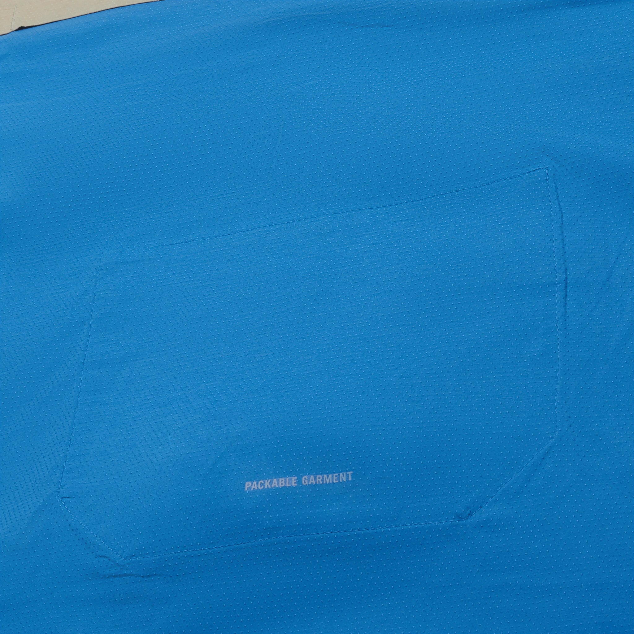 Back pocket view of Nike Repel Packable Beige Blue Windrunner Jacket CZ9071-252