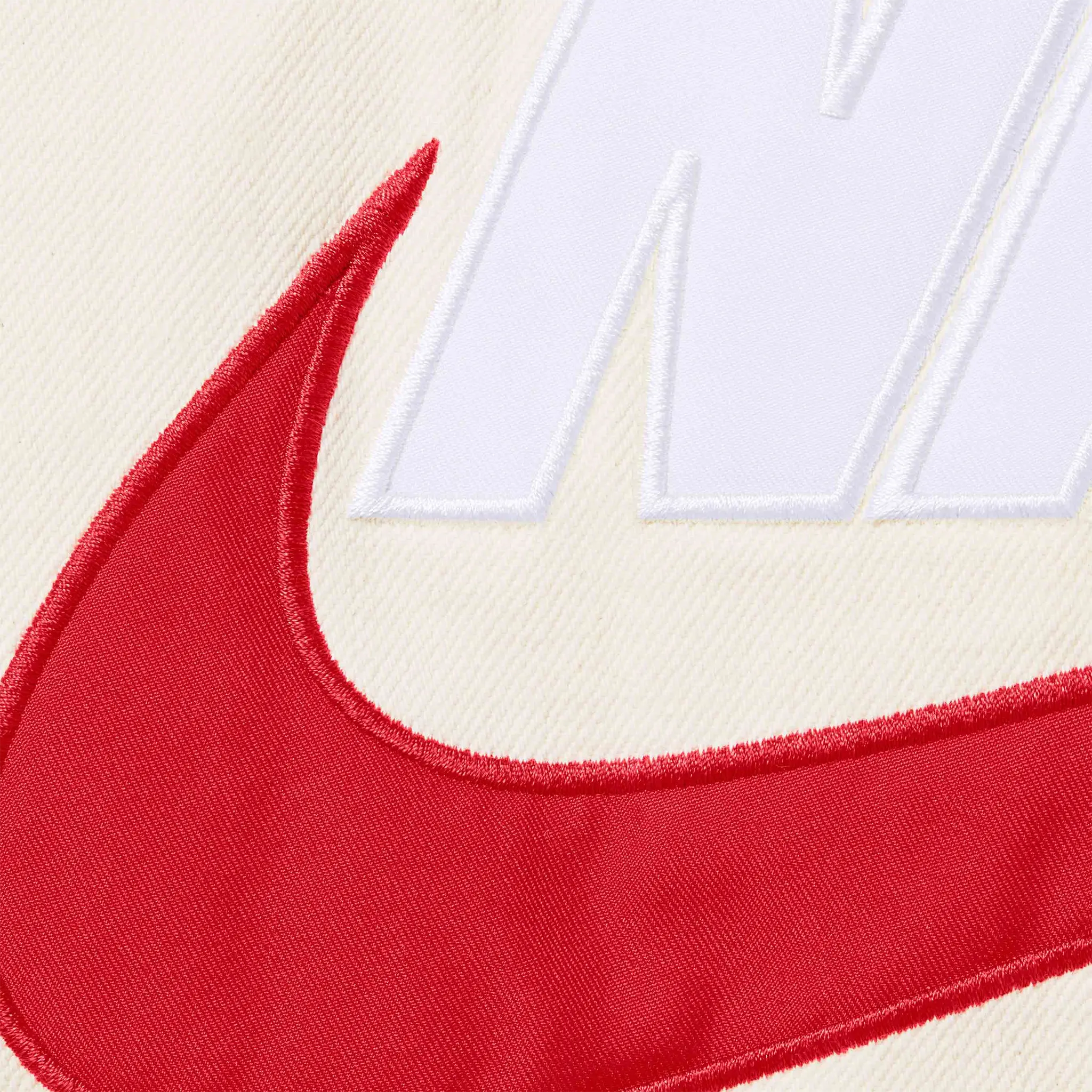 Detail view of Nike Supreme Denim Puffer Vest Natural White