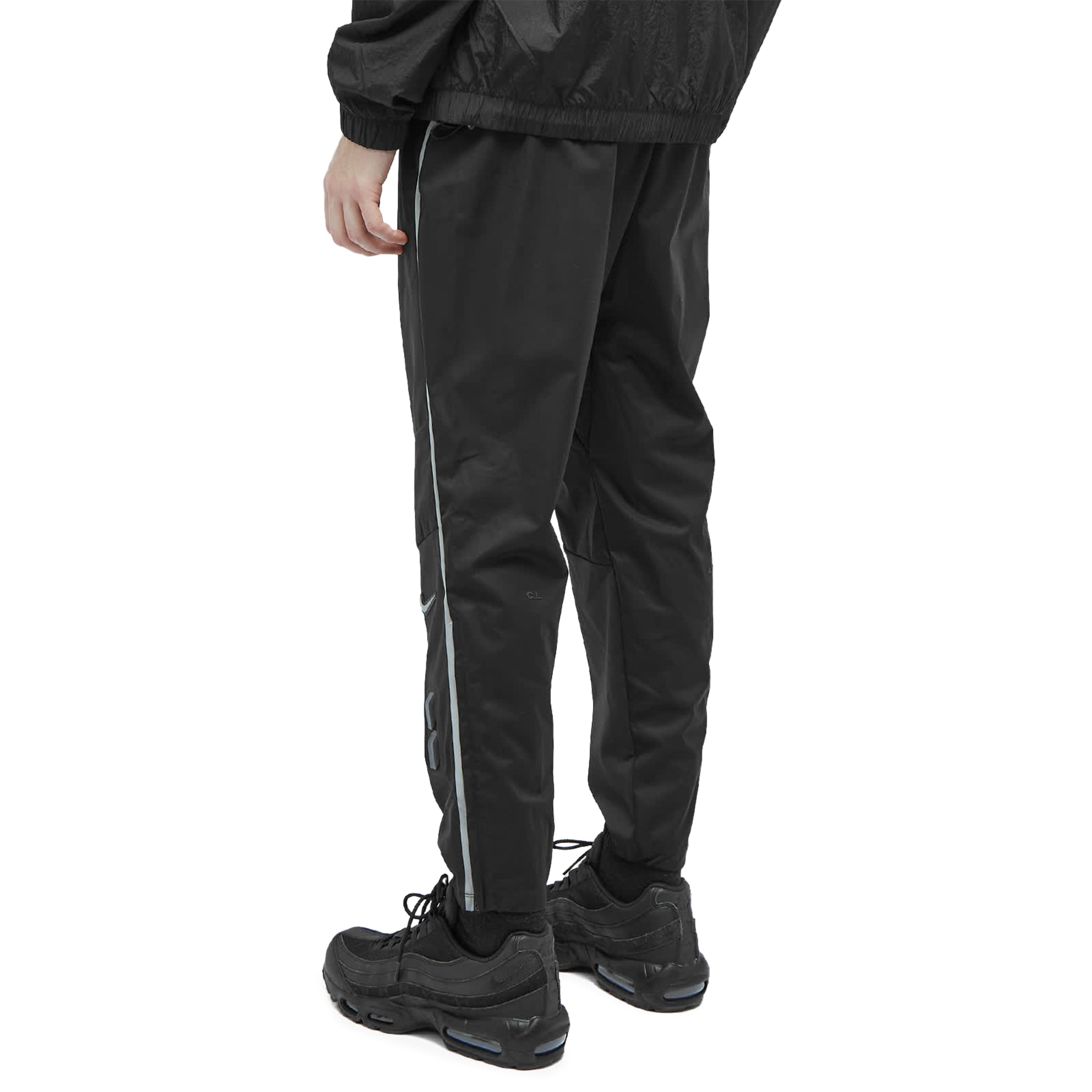 Model back view of Nike x Nocta NRG Warmup Black Pants DV3732-010