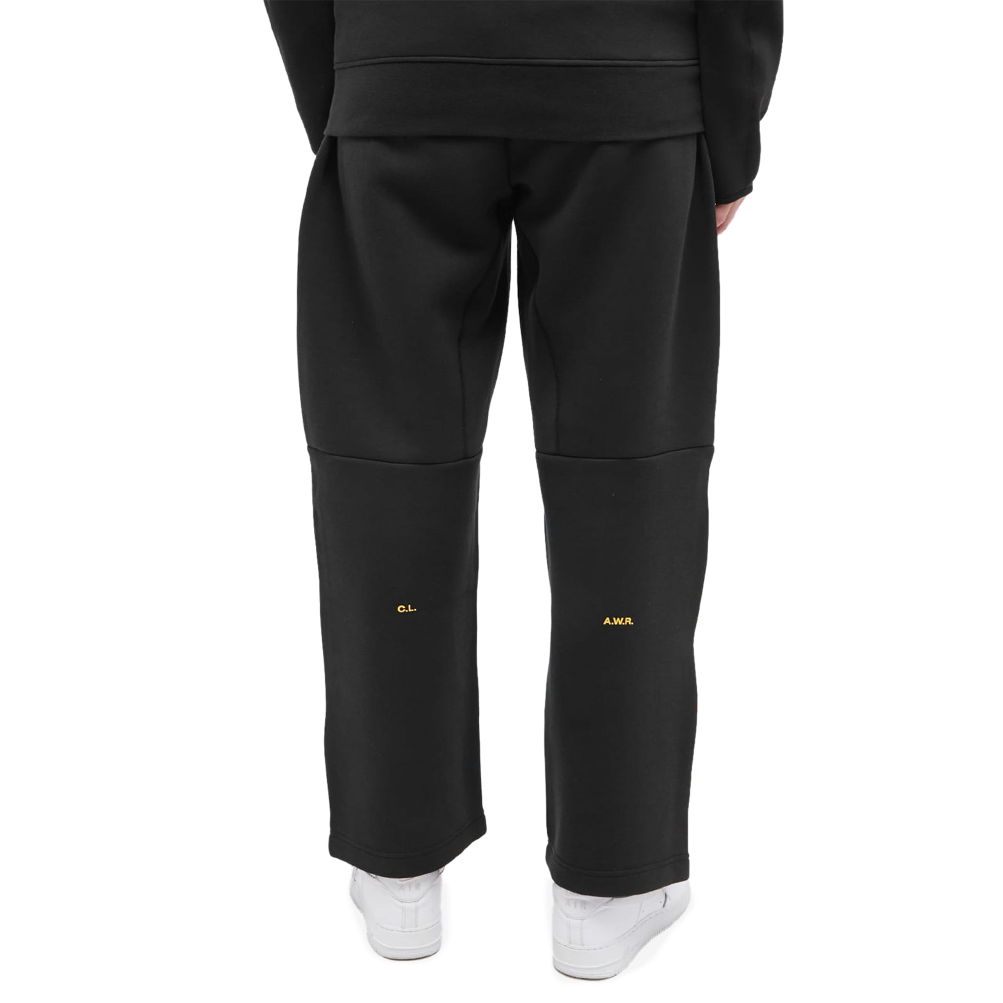 Model back view of Nike x nocta tech fleece black sweatpants FD8460-010