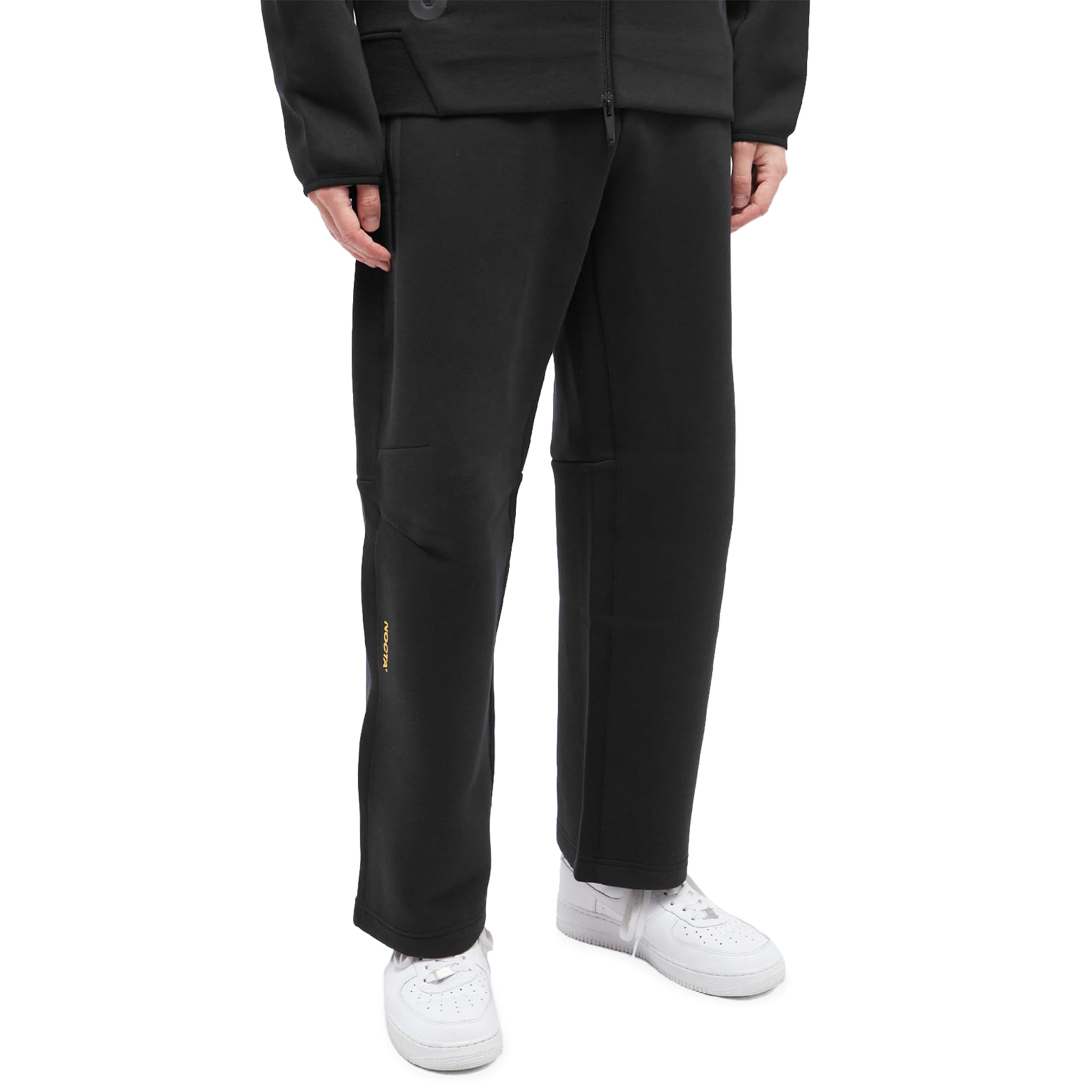 Model side view of Nike x nocta tech fleece black sweatpants FD8460-010