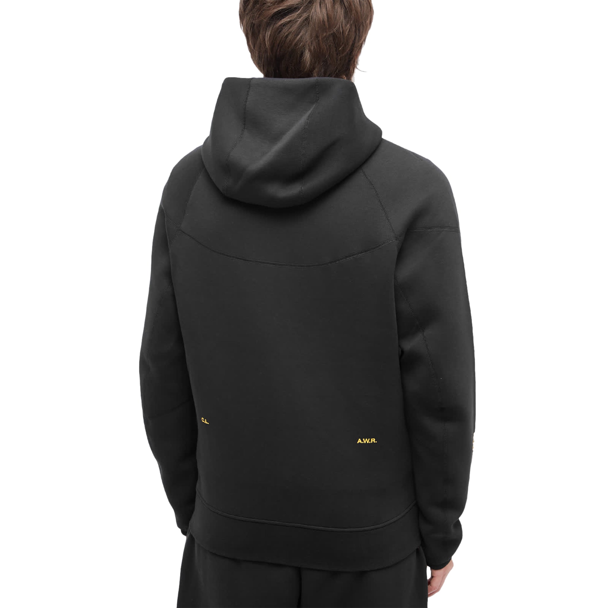 Model back view of nike x nocta tech fleece black zip-up hoodie fd8453-010