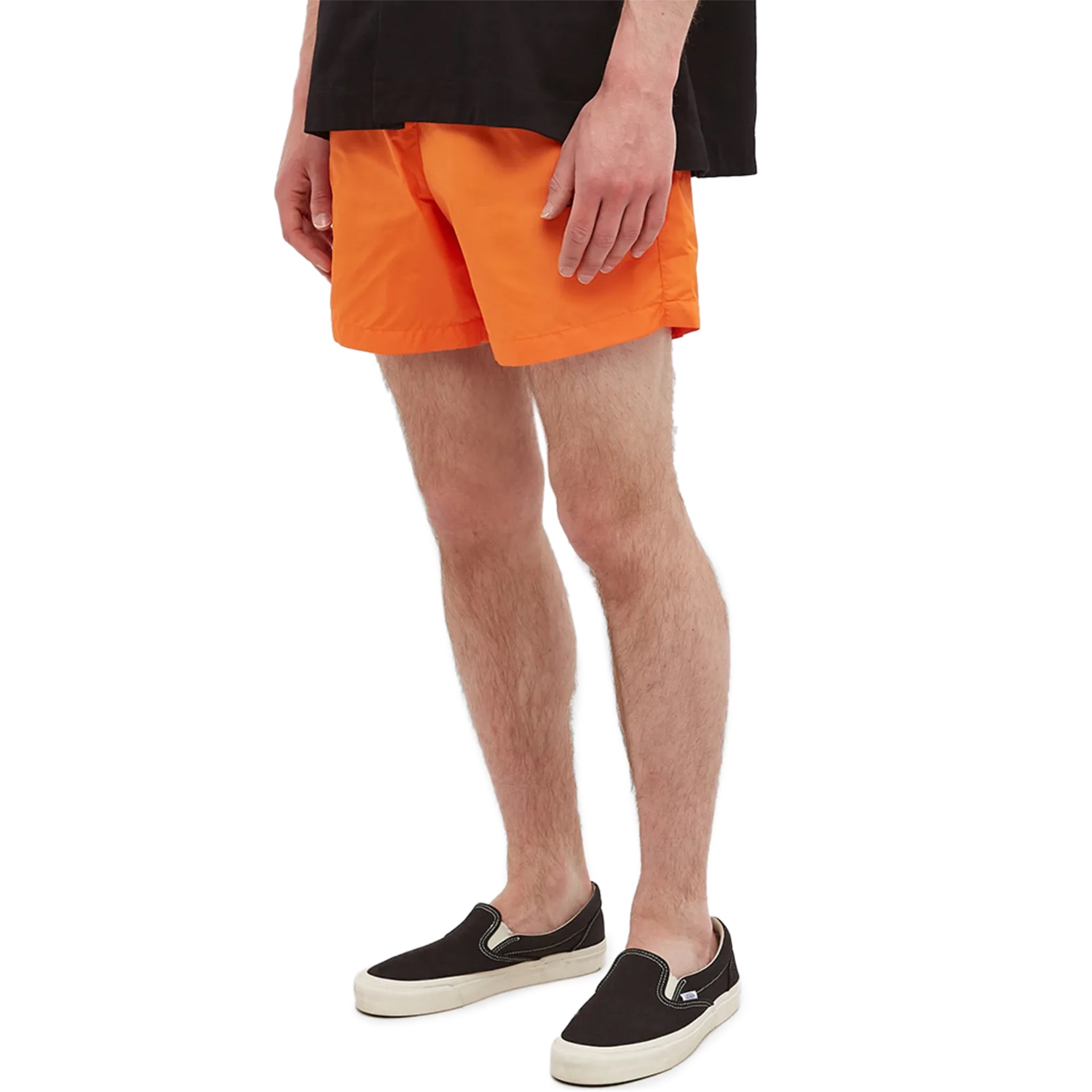 Model side view of Off-White Diagonal Outline Orange Swim Shorts OMFA003S22FAB0012010