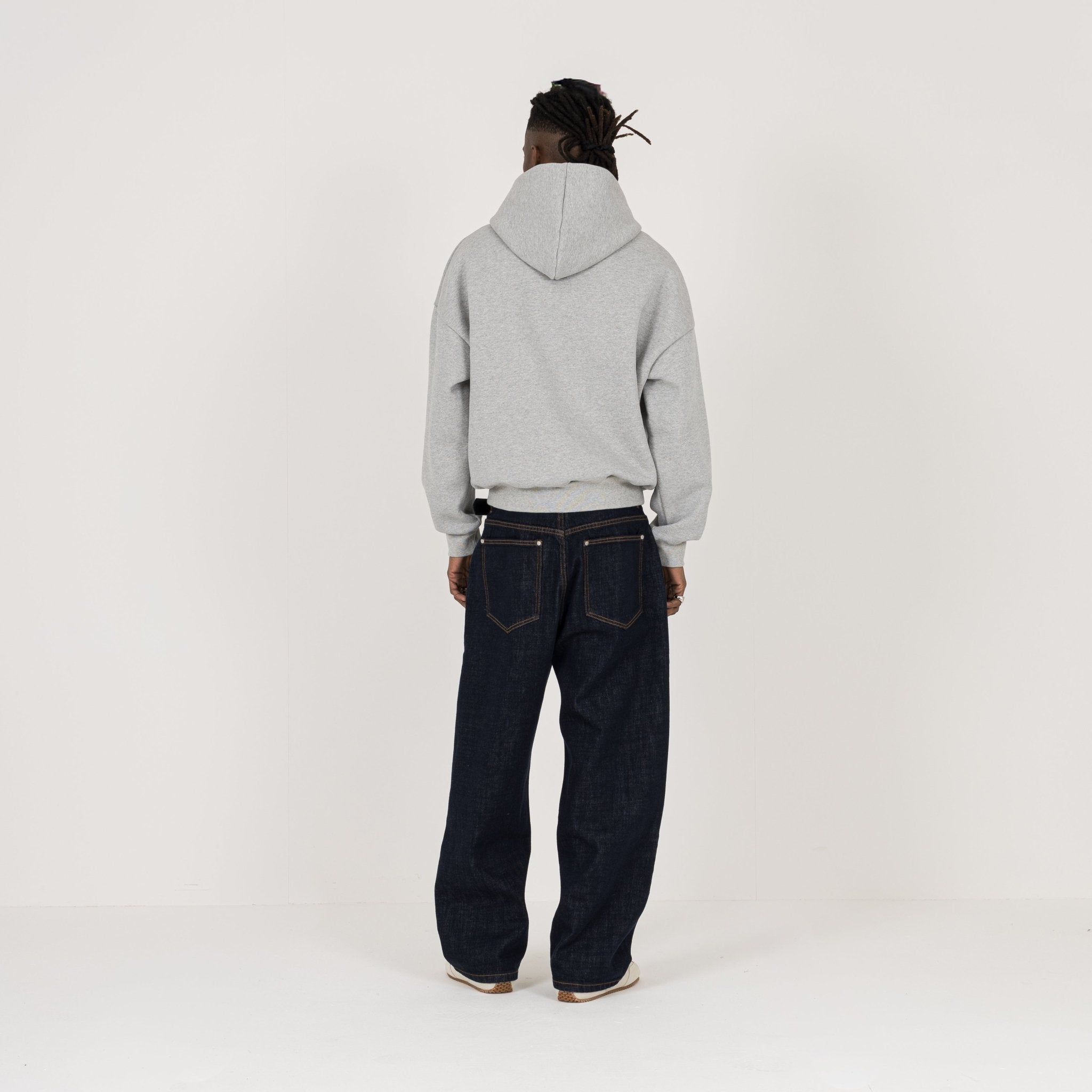 Model view of Destructive Relaxed Denim Raw Jeans