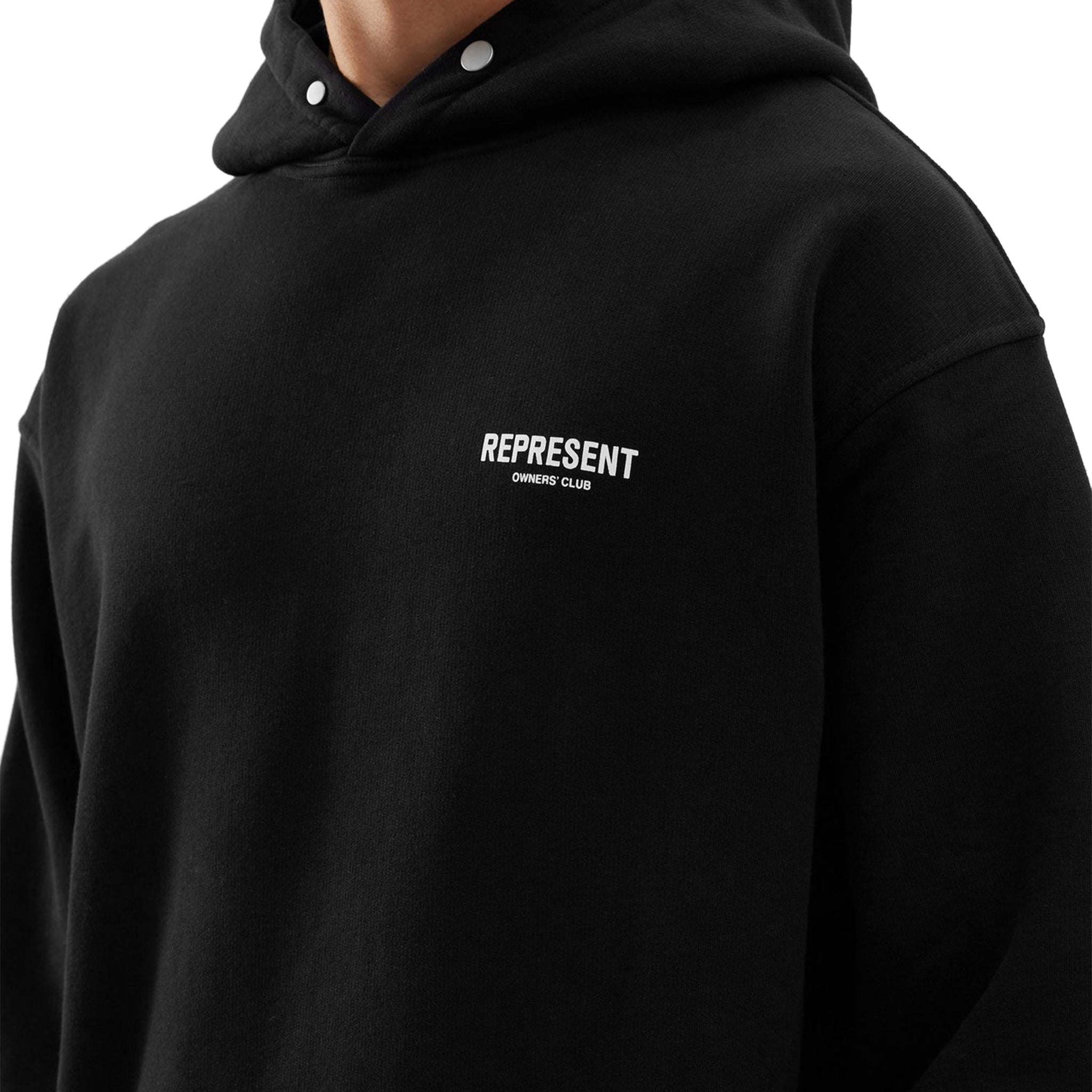 Model chest logo view of Represent Owners Club Black Hoodie M04153-01