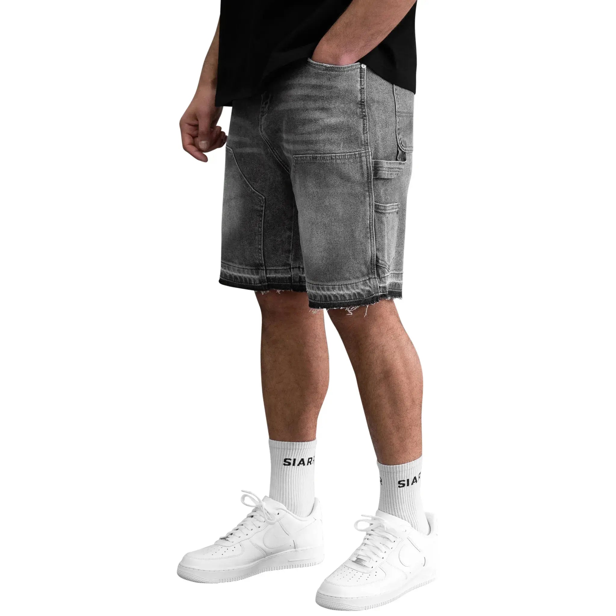Model side view of SIARR Carpenter Shorts Dark Grey